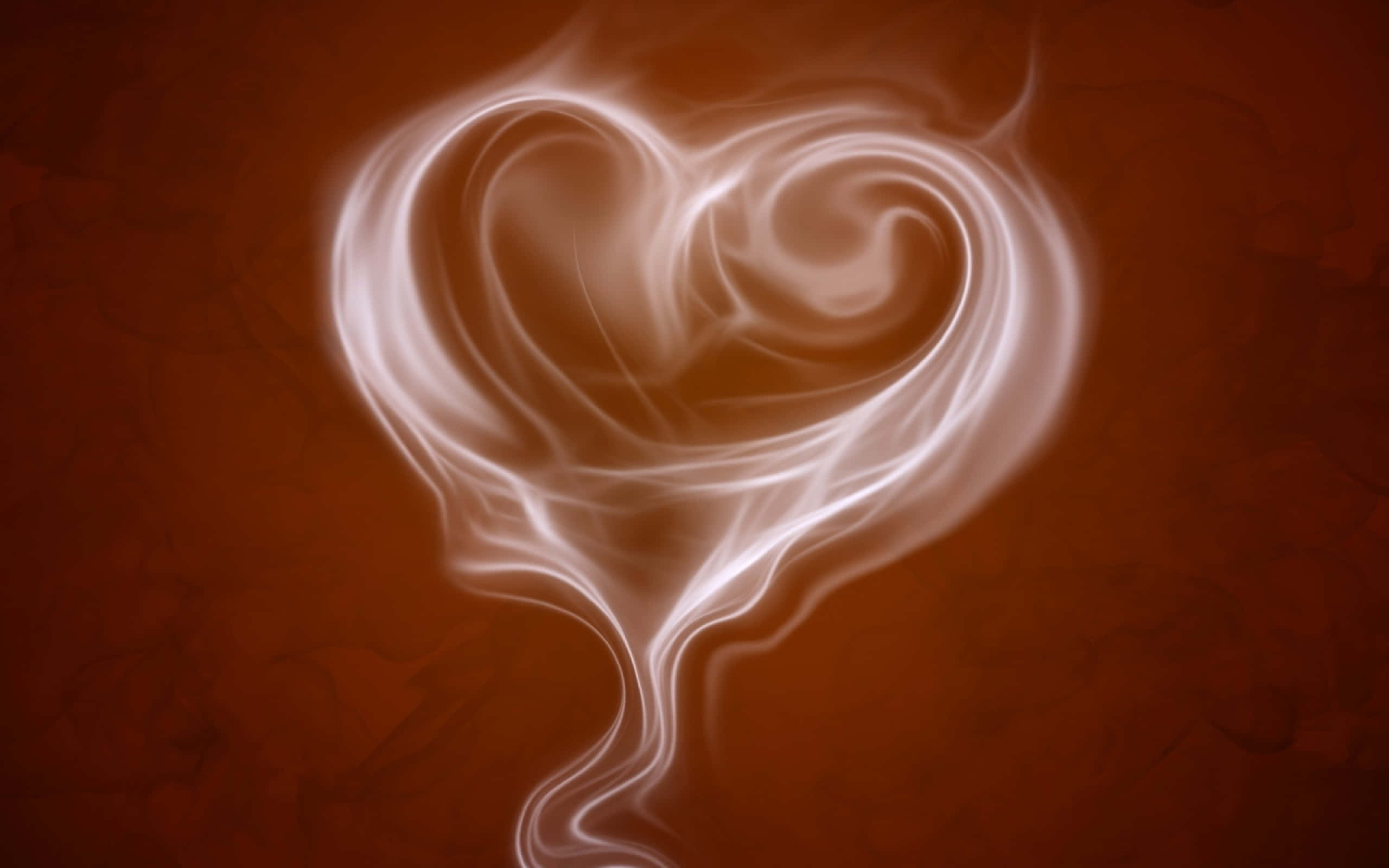 Heart Shape 桌布 壁紙 — 一個發光的白色心形煙霧漩渦在帶有紋理的深棕色背景上升起。