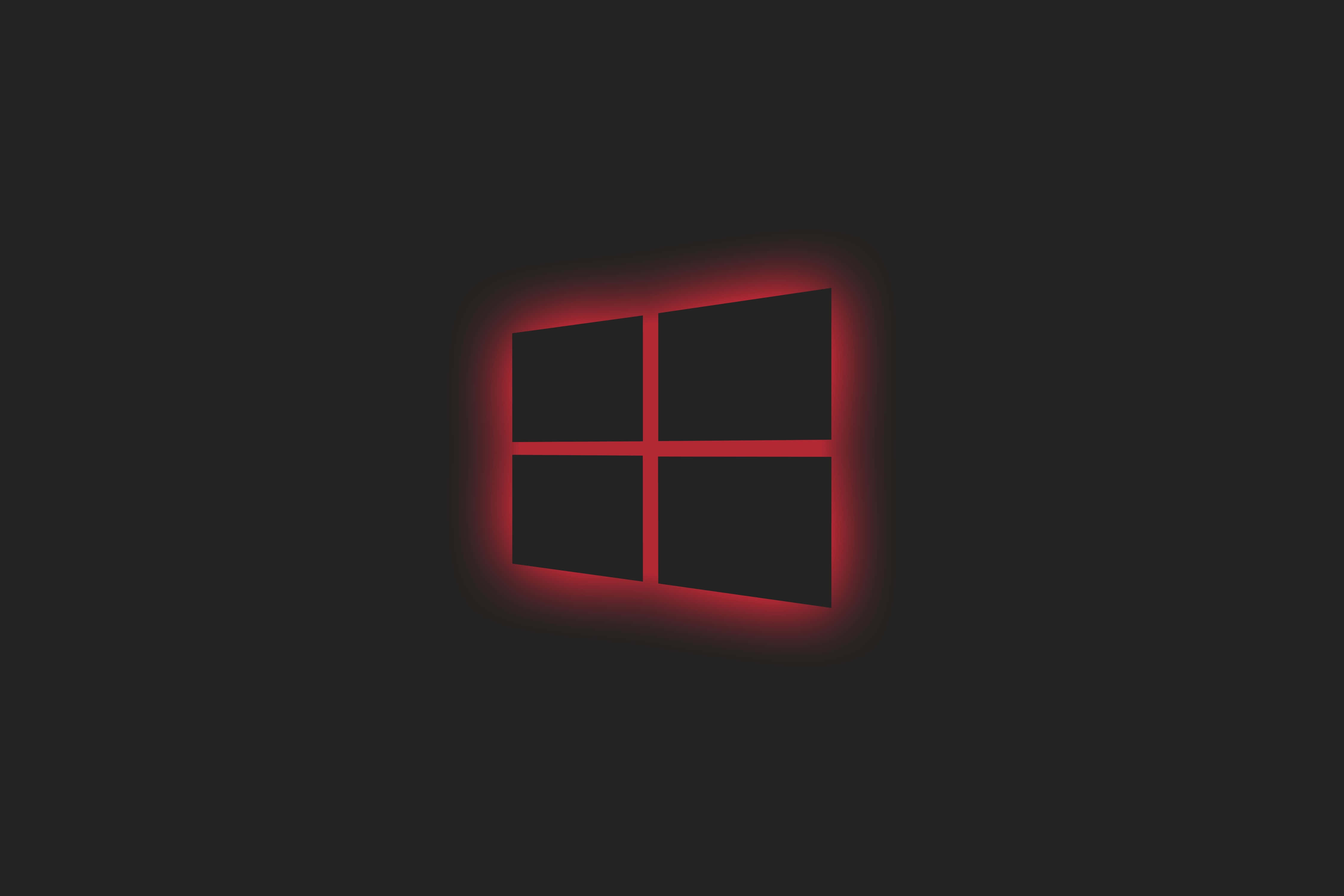 Black Windows 桌布 壁紙 — 一個發光的紅色Windows標誌，居中於深色背景上，帶有柔和的光暈。
