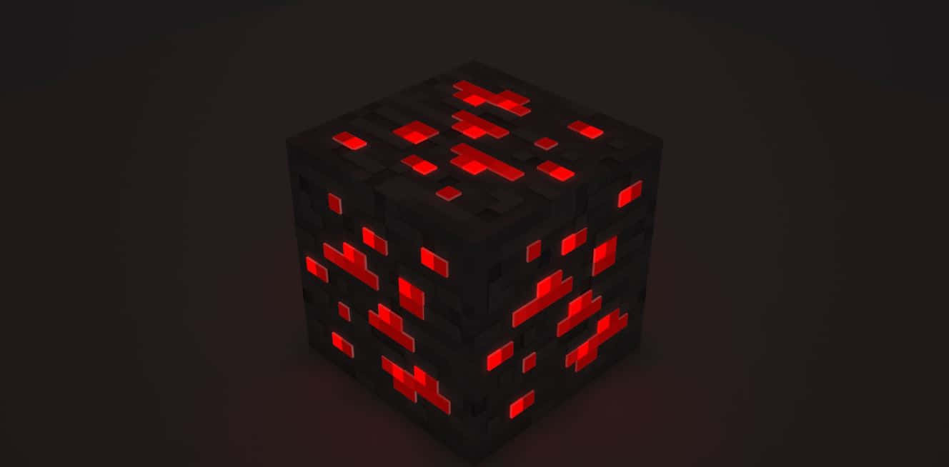Minecraft Redstone 桌布 壁紙 — 一個發光的紅色像素化立方體，帶有暗色方塊，在黑色背景上發出光芒。