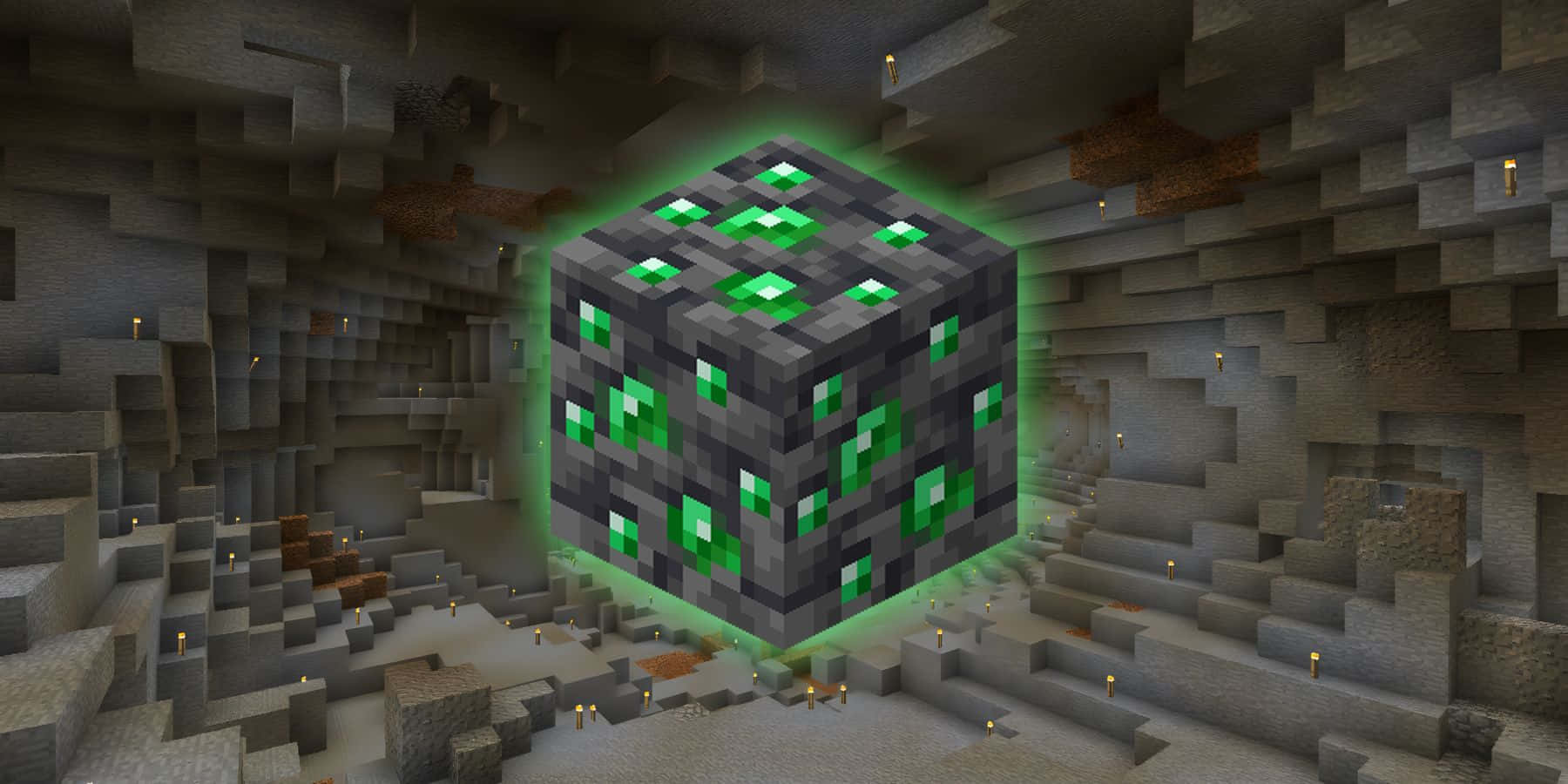 Minecraft Emeralds 桌布 壁紙 — 一個發光的綠色鑽石礦石方塊漂浮在一個由火炬照亮的昏暗Minecraft洞穴中。