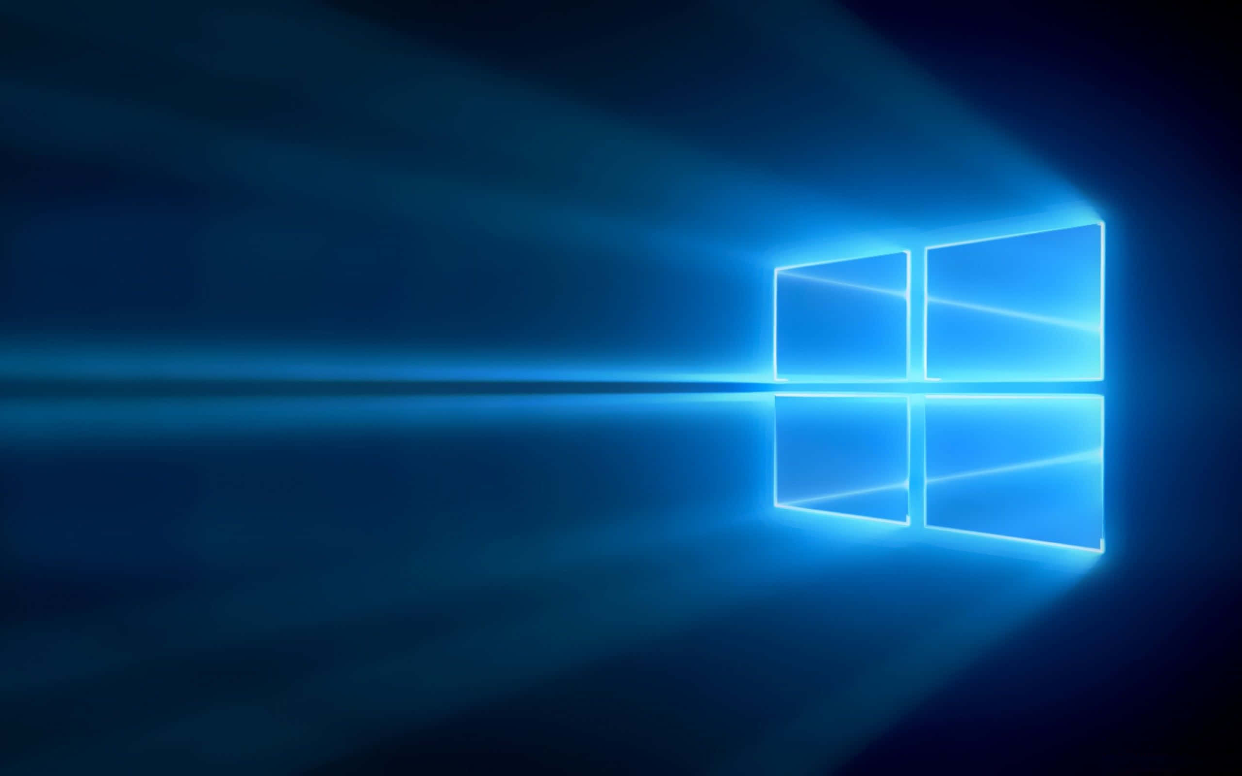 Old Windows 桌布 壁紙 — 一個發光的藍色Windows標誌在深色漸變背景上散發光芒，帶有鏡頭光暈效果。