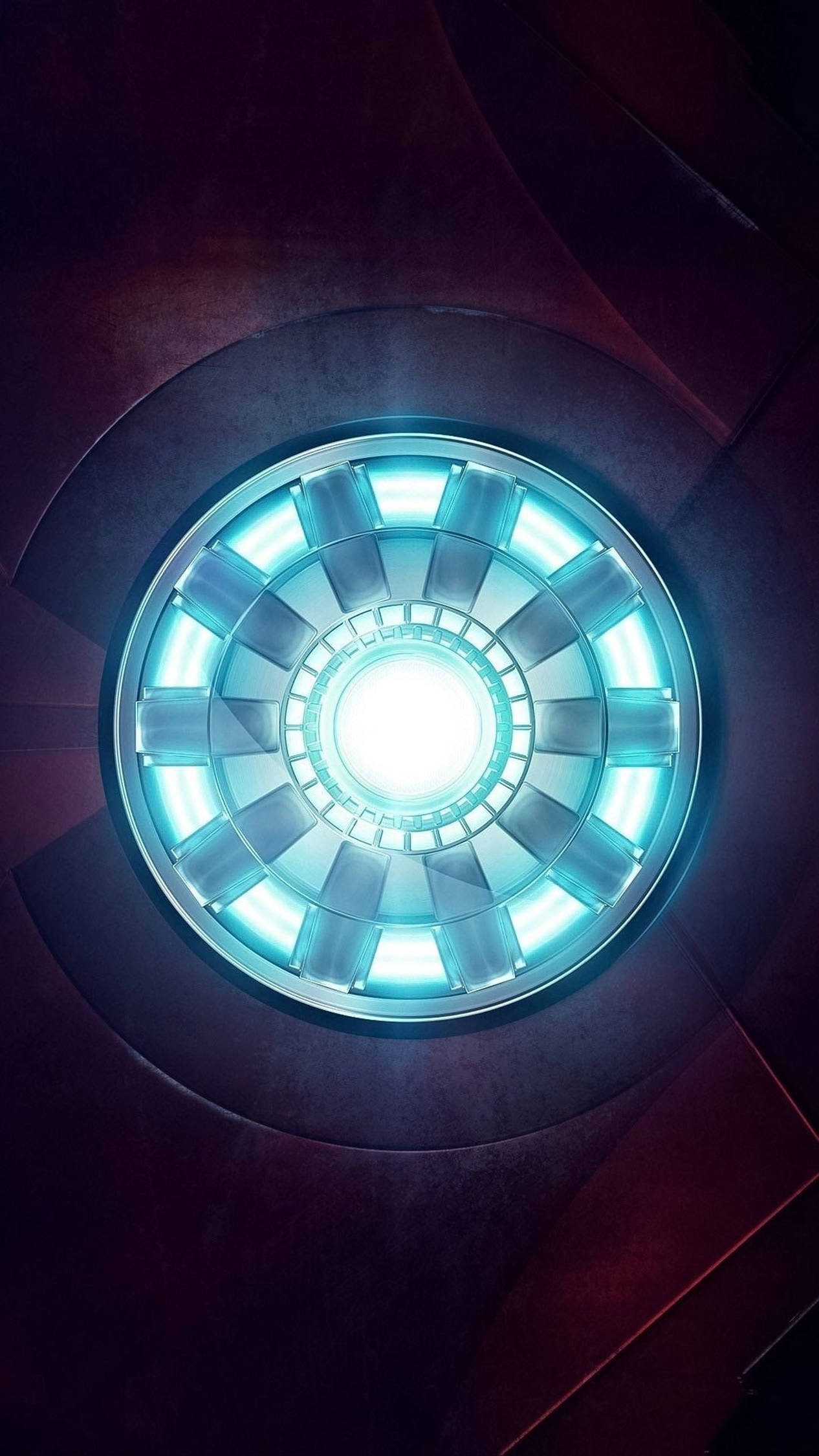 Iron Man 4K 桌布 壁紙 — 一個發光的藍色圓形電弧反應器嵌入在深色金屬牆壁中，從中心發出明亮的光。