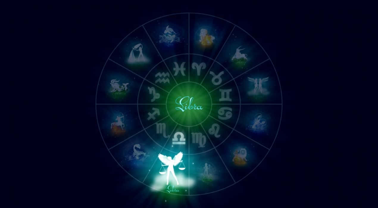 libra 桌布 壁紙 — 一個發光的黃道輪盤，天秤座位於中心，在黑暗的宇宙背景下散發著天體符號。