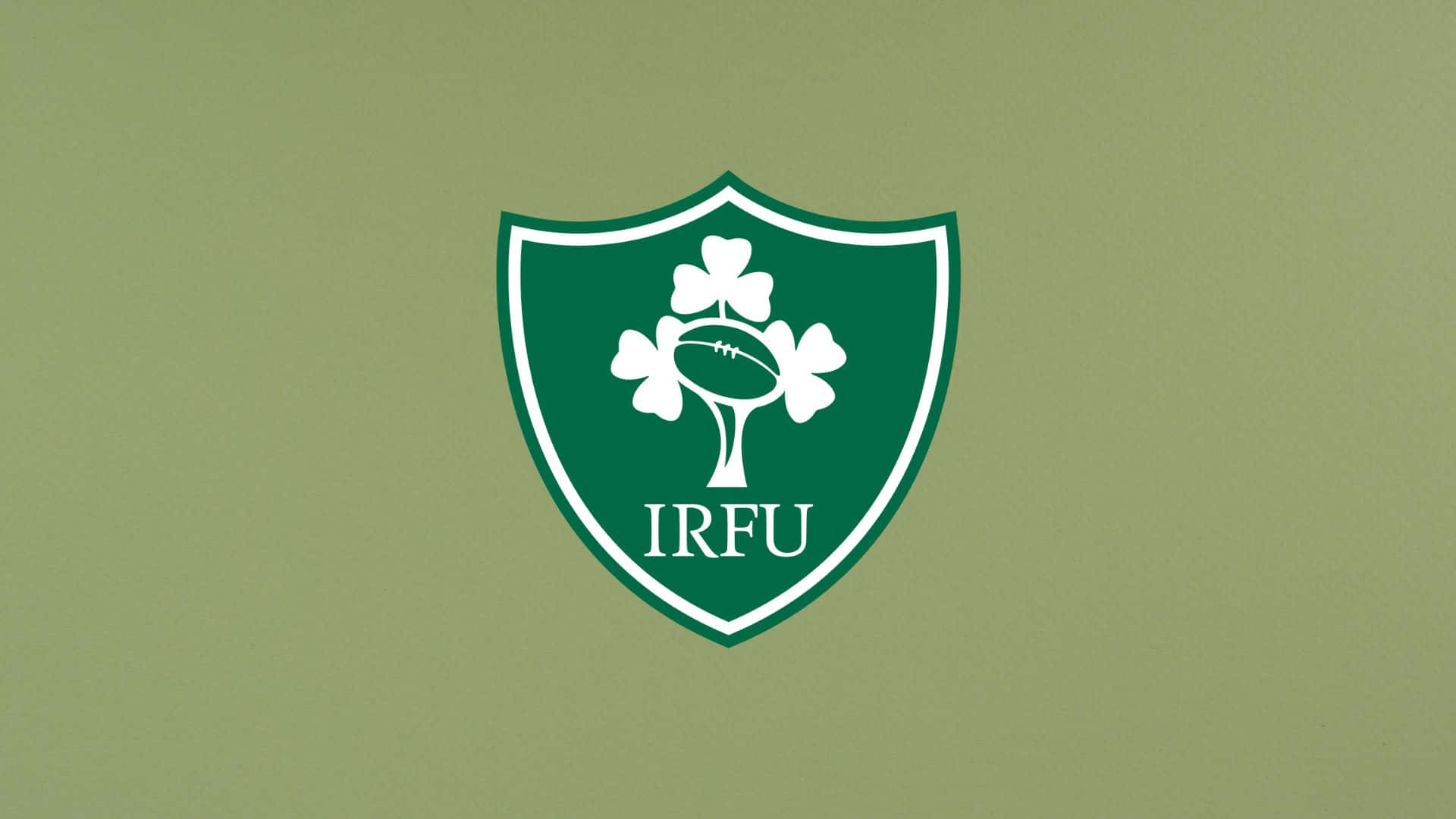 Ireland Rugby 桌布 壁紙 — 一個白色IRFU盾牌標誌，中央有一棵三葉草樹和一個欖球，置於純橄欖綠色背景上。