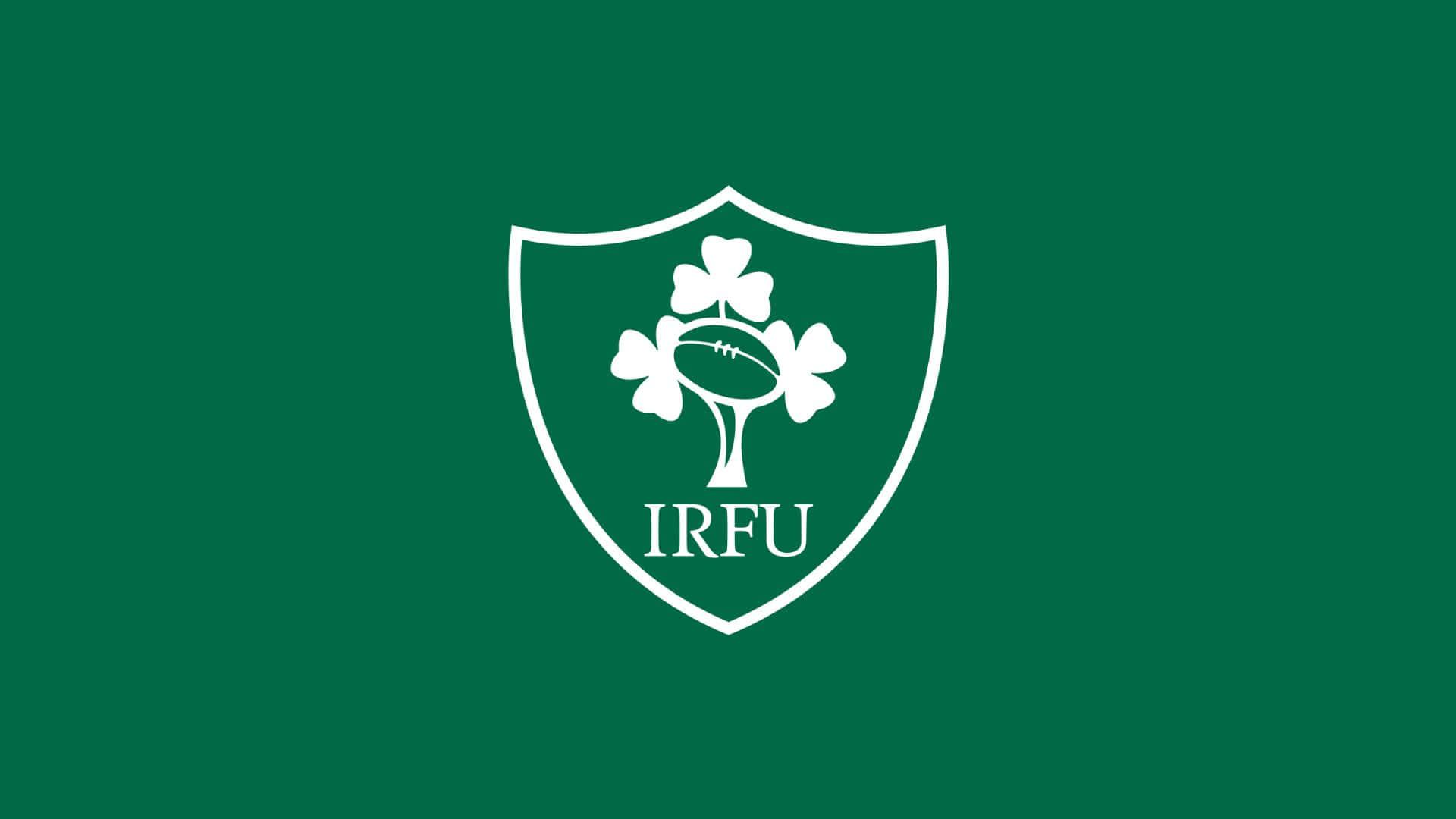 Ireland Rugby 桌布 壁紙 — 一個白色愛爾蘭欖球聯盟徽章，上有三葉草和欖球，背景為純綠色。