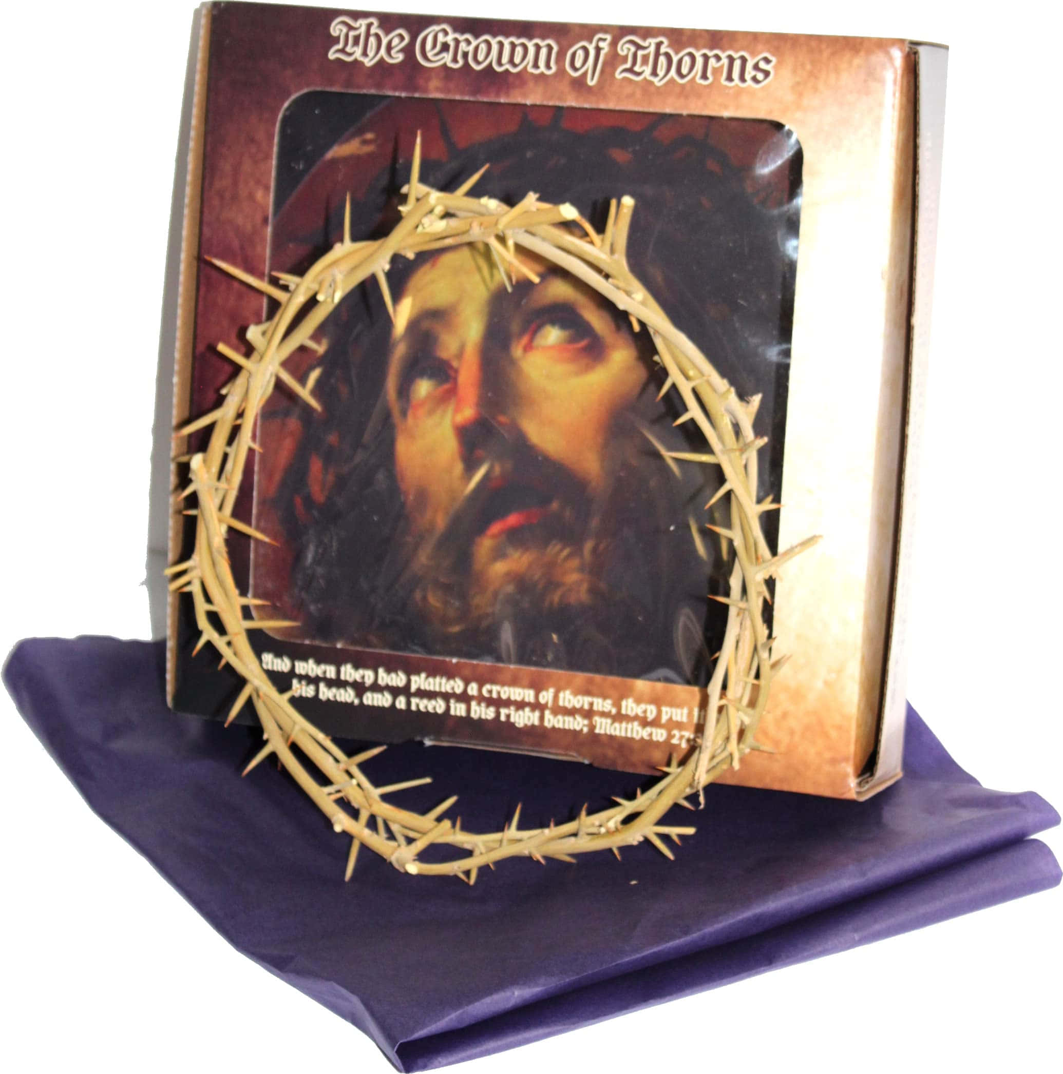 Jesus Crown Of Thorns 桌布 壁紙 — 一個真實的荊棘冠冕放在紫色布料上，前面有一個描繪耶穌戴著荊棘冠冕並帶有聖經文字的盒子。
