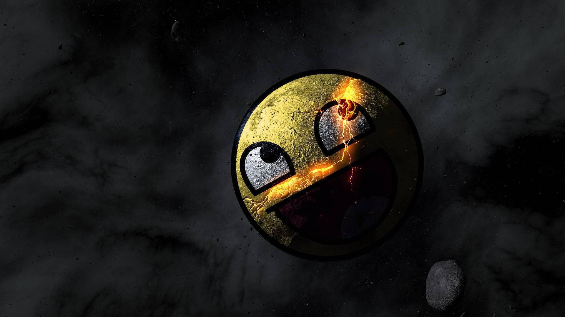 emoji 桌布 壁紙 — 一個破裂的金色 Pac-Man 表情符號漂浮在太空中，閃電穿過它的臉，背景是黑暗的宇宙。