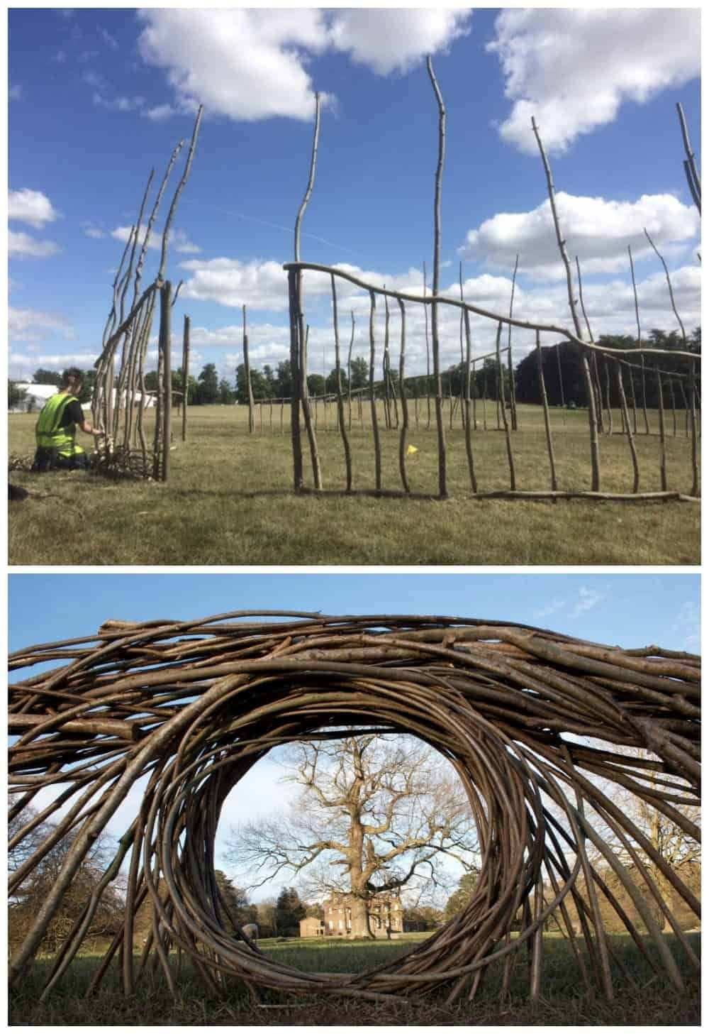 Installation Art 桌布 壁紙 — 一個穿著亮色背心的人正在藍天白雲下的草地上組裝一個大型樹枝雕塑。