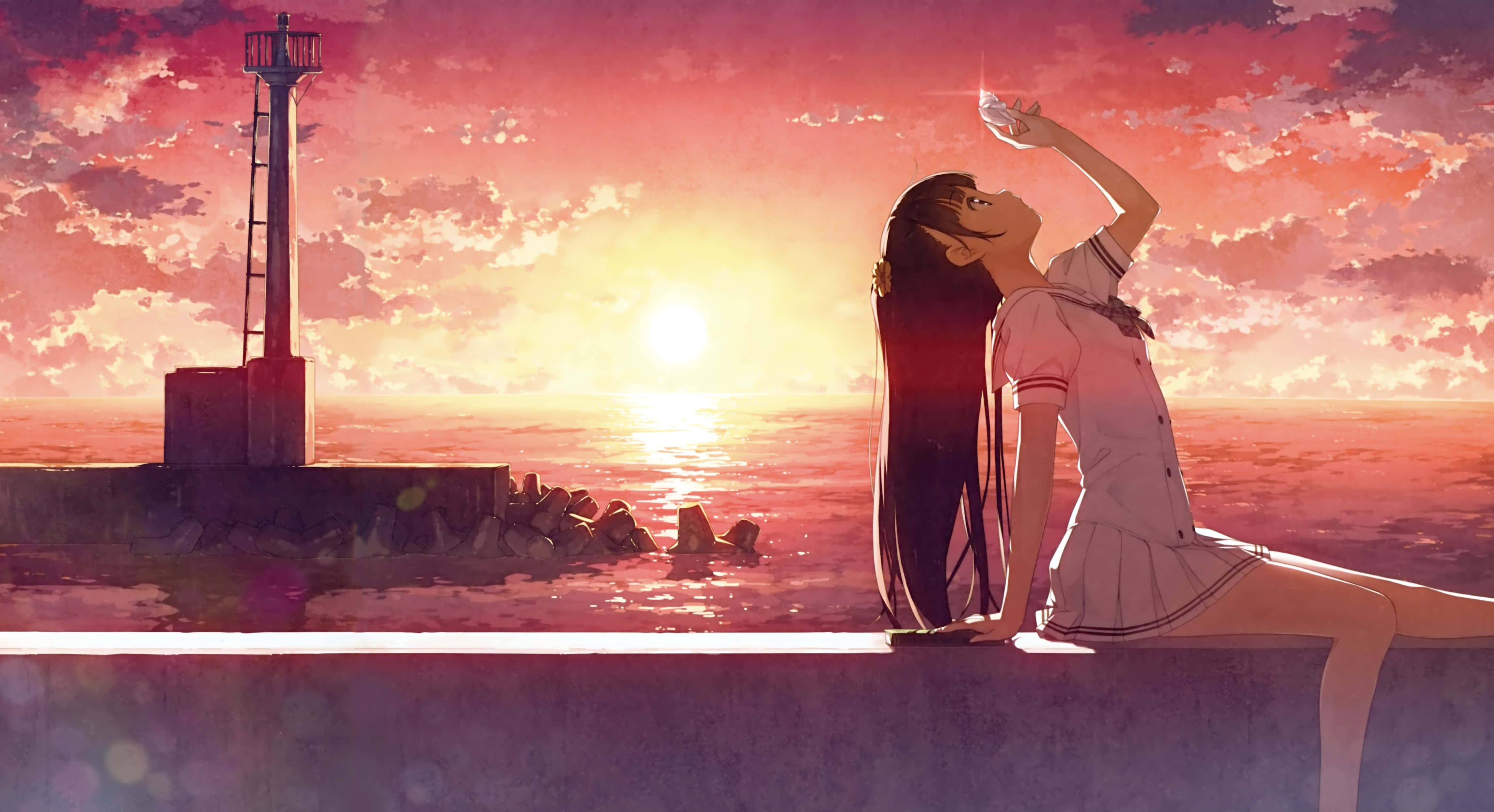 Anime Sunset 桌布 壁紙 — 一個穿著校服的女孩子坐在海邊，夕陽下手持發光球體，遠處有一座燈塔。
