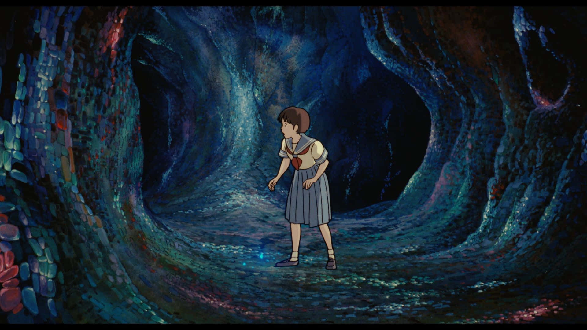 Whisper Of The Heart 桌布 壁紙 — 一個穿著校服的年輕女孩獨自站在一個廣闊、發光的藍色洞穴中，洞穴牆壁有紋理，並散佈著光粒子。
