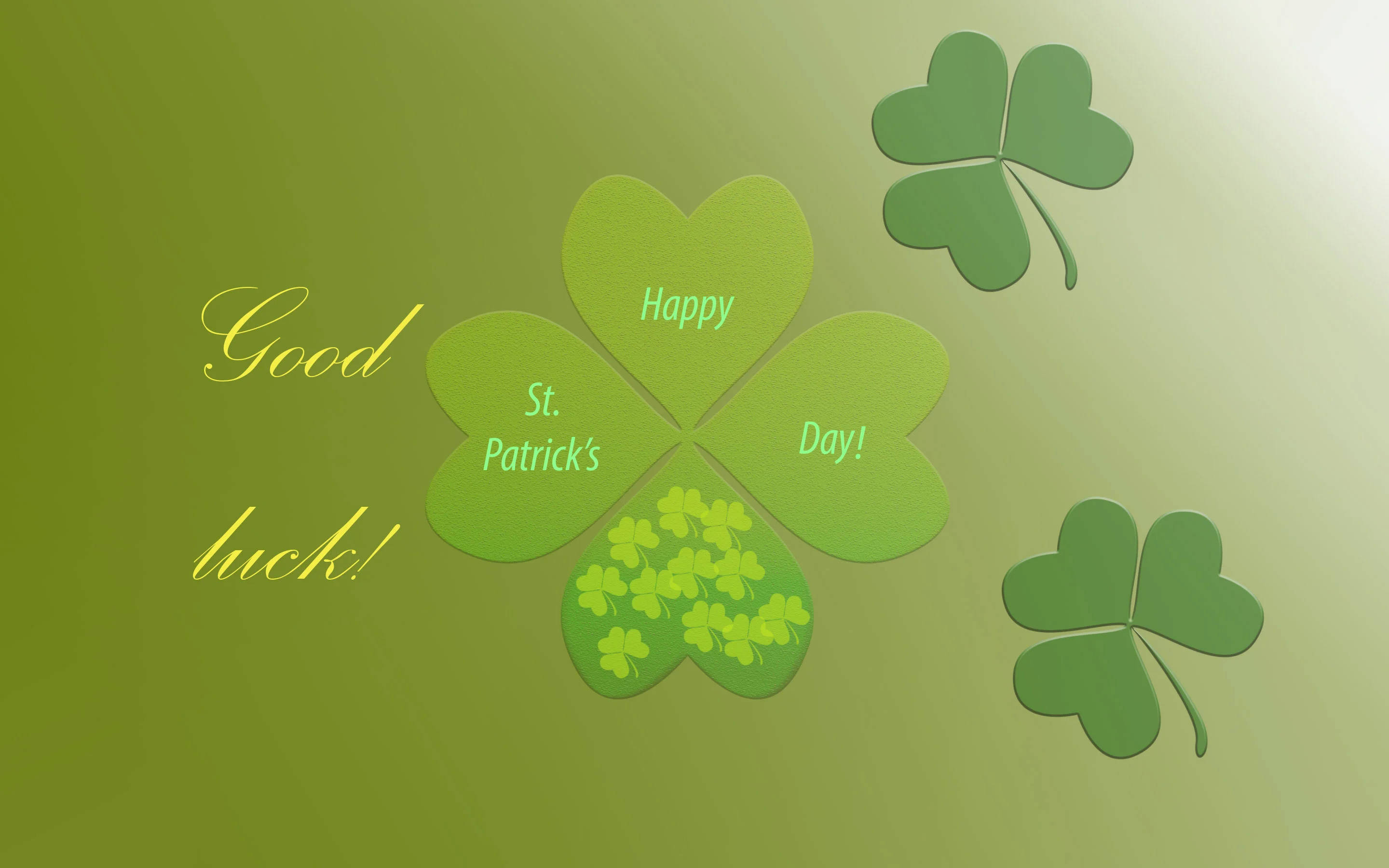 Happy St Patricks Day 桌布 壁紙 — 一個節日風格的綠色四葉草，帶有「Happy St. Patrick's Day!」文字和較小的三葉草，背景為綠色漸變。