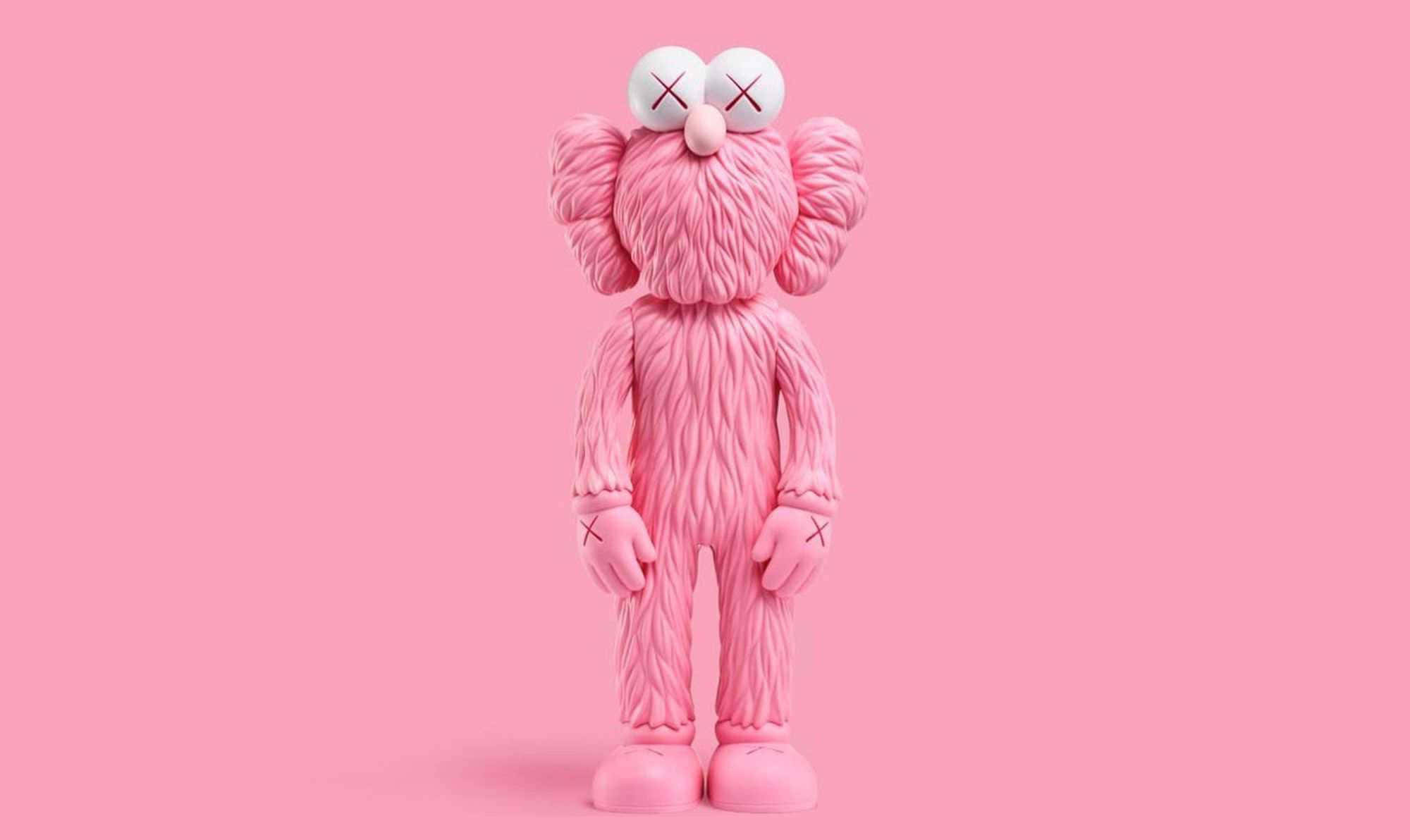 Kaws Bff Pink 桌布 壁紙 — 一個粉紅色的KAWS公仔，帶有X形眼睛，在極簡的攝影棚燈光下，站在純粉紅色背景前。