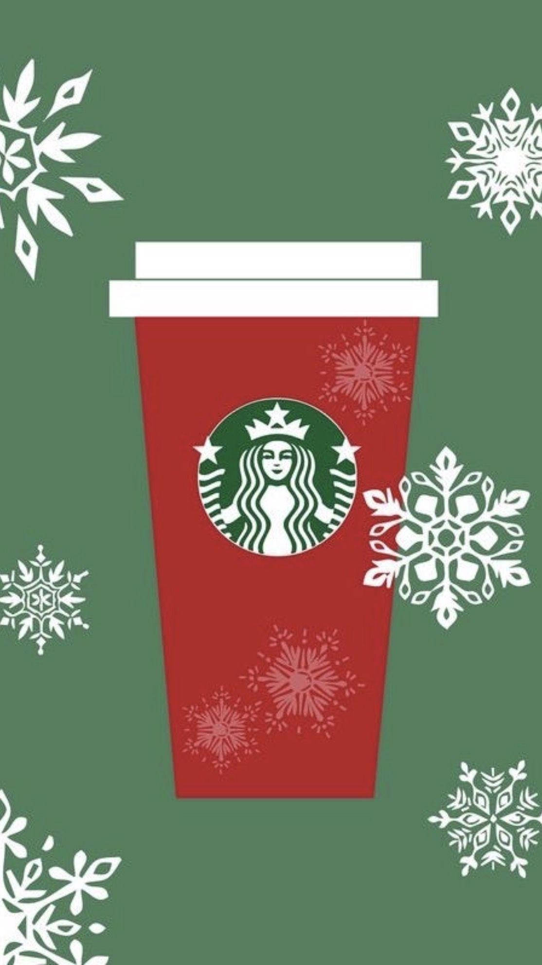 雪花 桌布 壁紙 — 一個紅色Starbucks節日杯，帶白色蓋子和雪花圖案，居中於帶有白色雪花的綠色背景上。