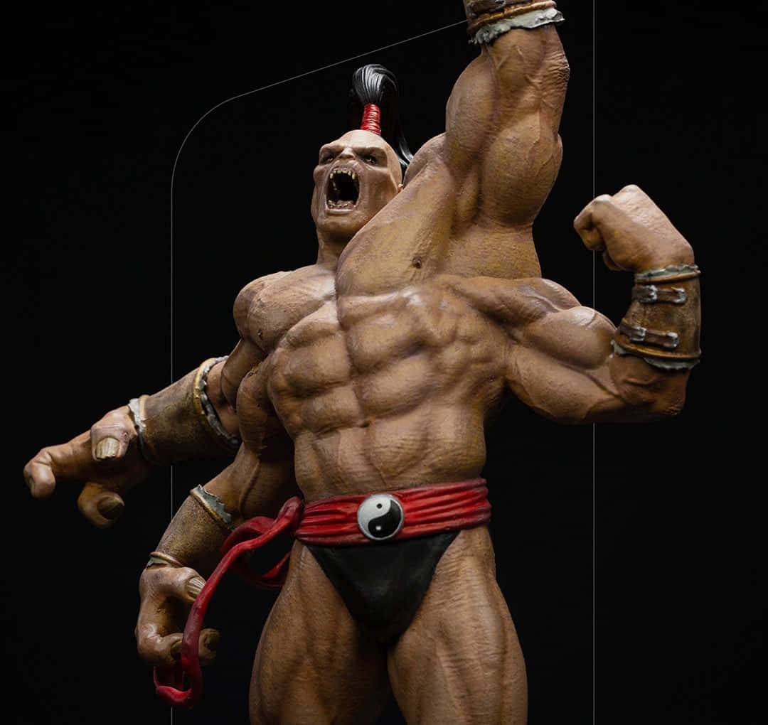 Mortal Kombat Goro 桌布 壁紙 — 一個肌肉極度發達的奇幻戰士雕像，單臂高舉，在純黑背景下咆哮。