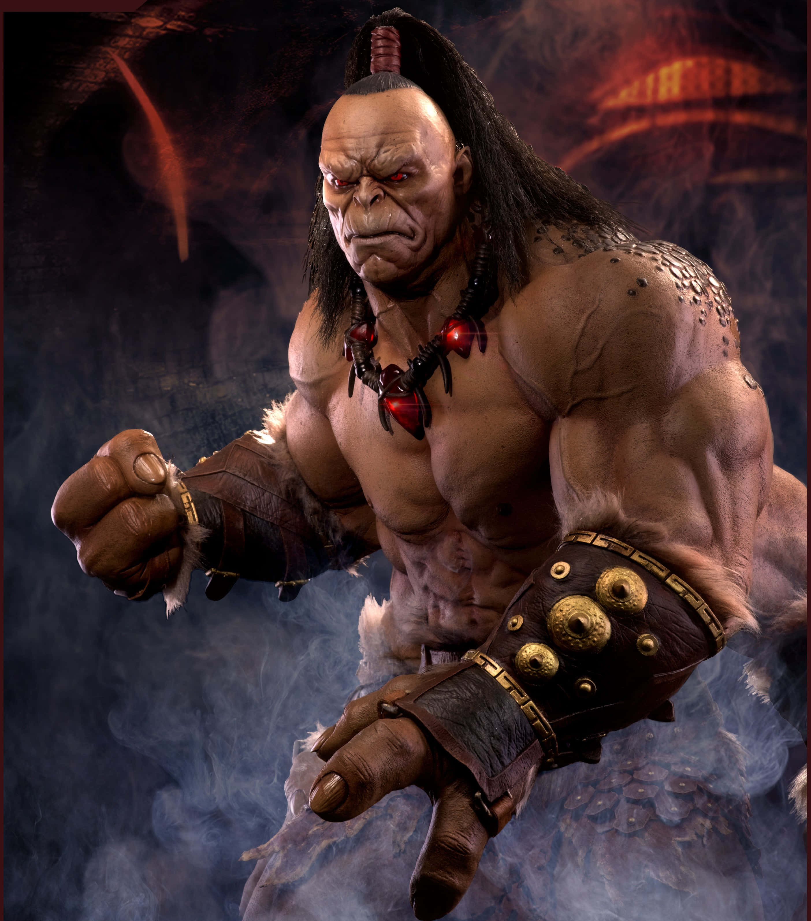 Mortal Kombat Goro 桌布 壁紙 — 一個肌肉發達、憤怒的戰士，紅眼睛和部落裝備，穿過煙霧瀰漫的黑暗向前猛衝。