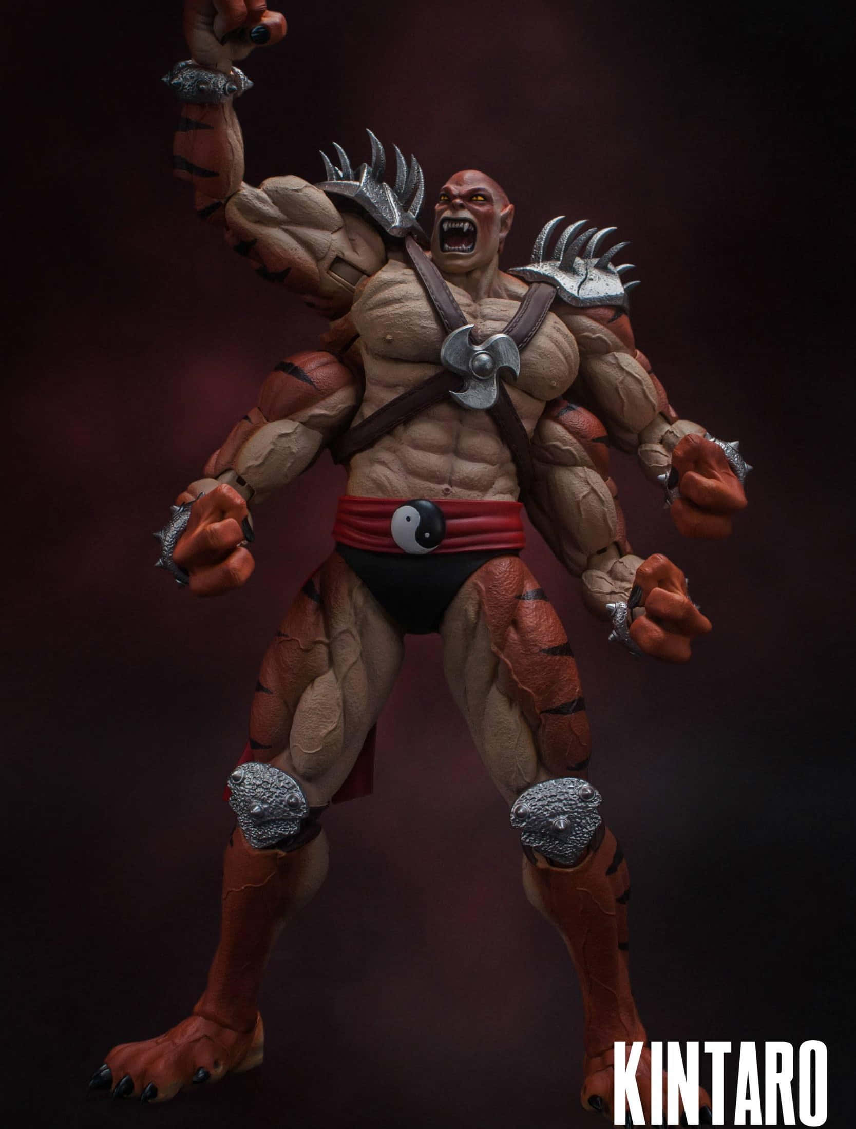 Mortal Kombat Kintaro 桌布 壁紙 — 一個肌肉發達的Kintaro動作人偶，戴著尖刺護手，虎紋皮膚，在深紅色背景下咆哮。