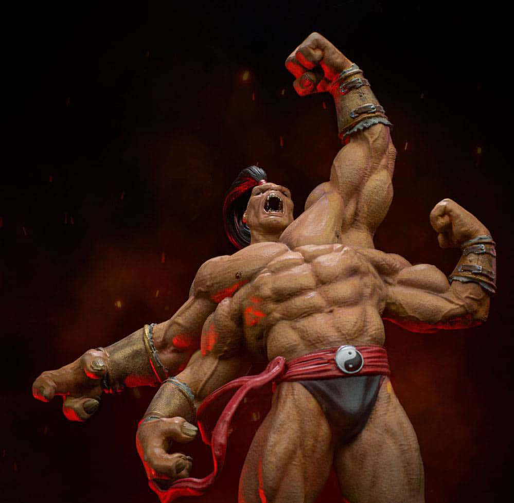 Mortal Kombat Goro 桌布 壁紙 — 一個肌肉發達的戰士在黑暗背景中咆哮，一隻拳頭高舉，紅色火花四濺。
