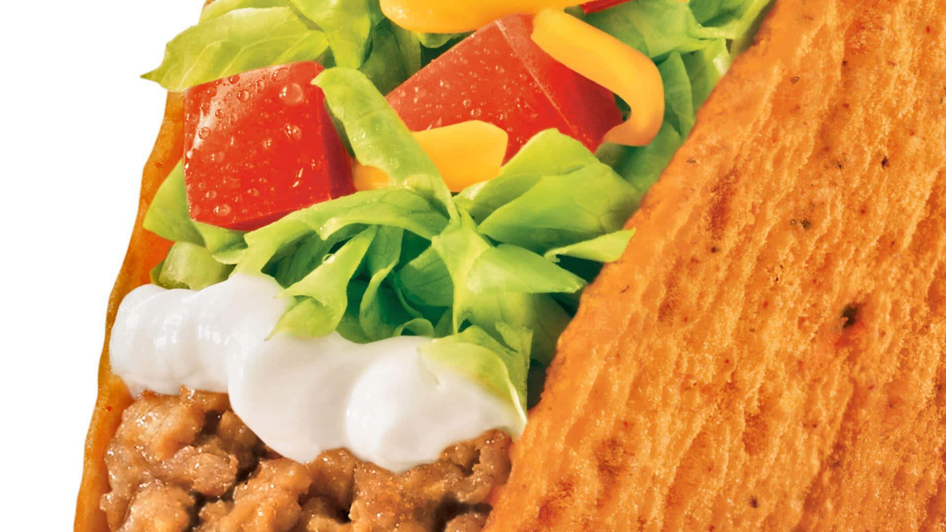 Taco 桌布 壁紙 — 一個脆皮墨西哥卷嘅特寫，裡面有調味肉、酸忌廉、生菜同色彩繽紛嘅燈籠椒。