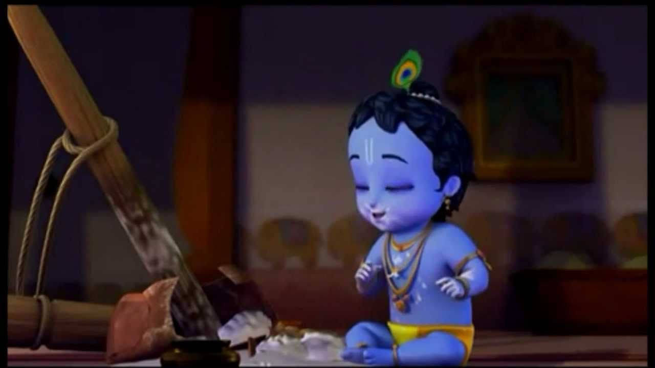 krishna god 桌布 壁紙 — 一個藍皮膚的動畫嬰兒克里希納戴著孔雀羽毛皇冠，平靜地坐在光線昏暗的房間裡。