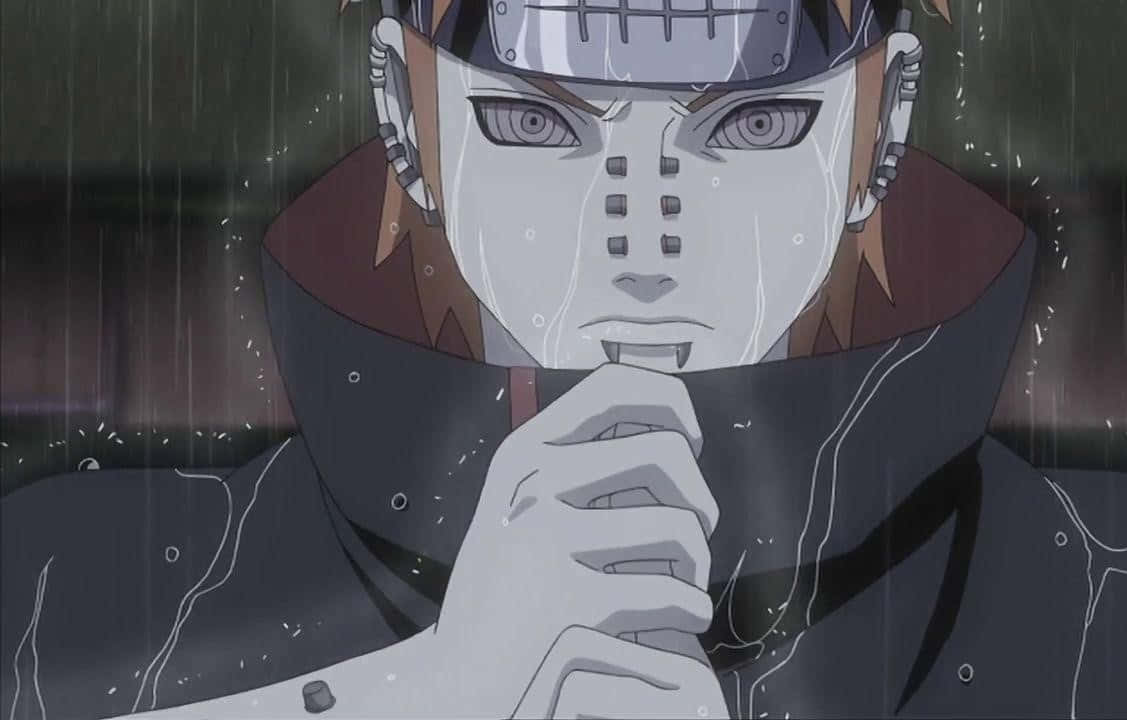 Pain 桌布 壁紙 — 一個被雨淋濕的動漫角色，戴著白色面具和紅色斗篷，雙手合十放在嘴邊，凝視著前方。