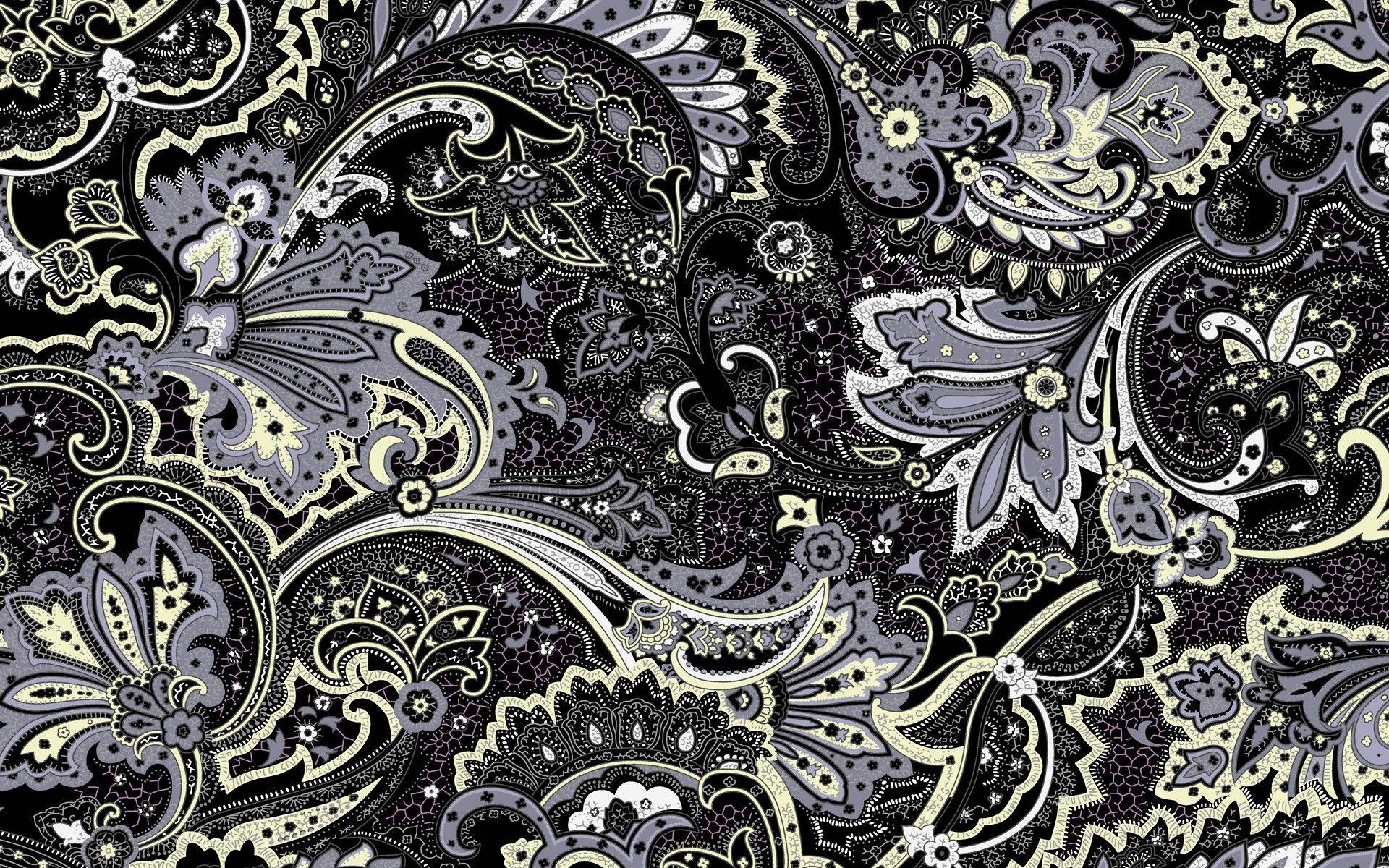 圖案 桌布 壁紙 — 一個複雜的黑白奶油色佩斯利圖案，帶有漩渦花卉圖案和點狀紋理，充滿了整個畫面。