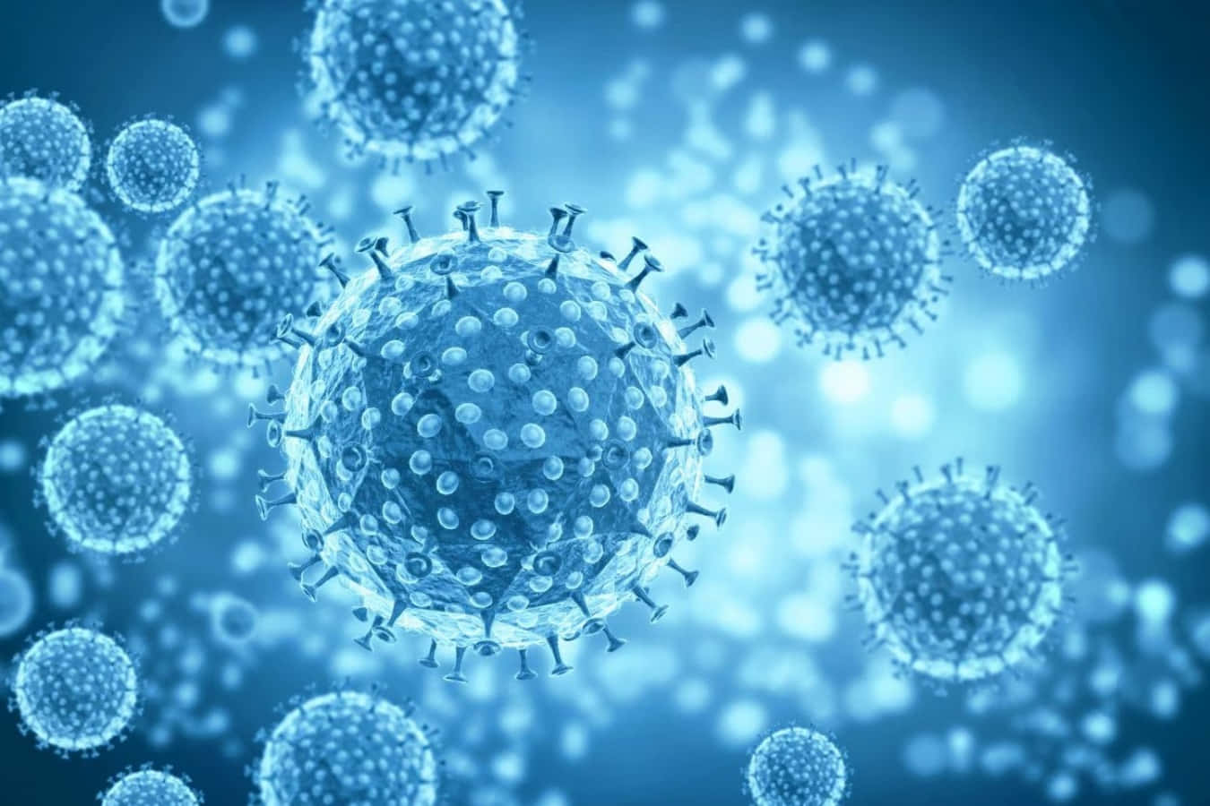 Coronavirus 桌布 壁紙 — 一個詳細的3D渲染，顯示病毒粒子在發光的藍色醫療環境中漂浮。