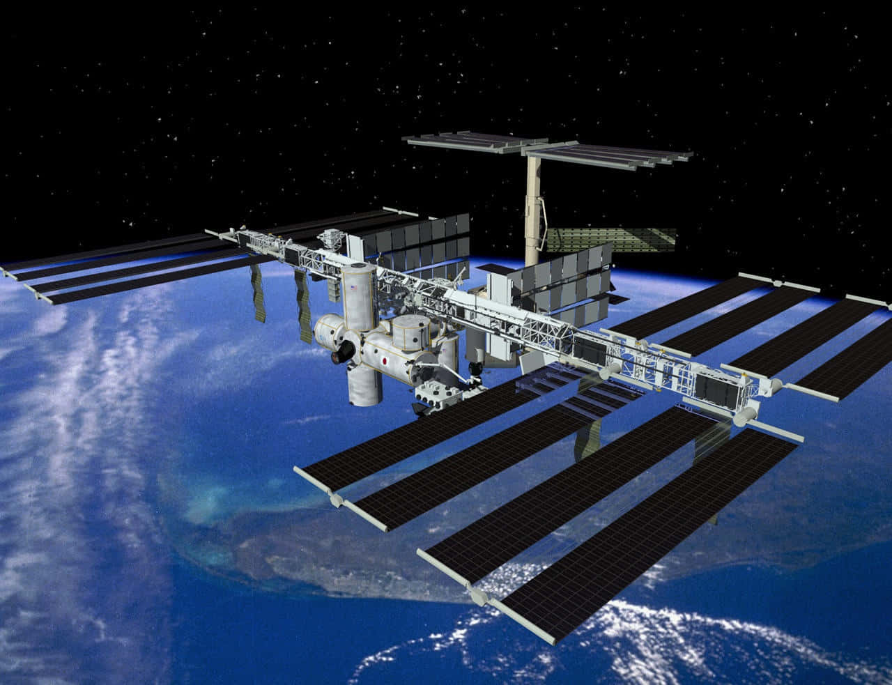 Iss 桌布 壁紙 — 一個詳細的太空站繞地球運行，太陽能板展開，背景是繁星點點的黑色天空。