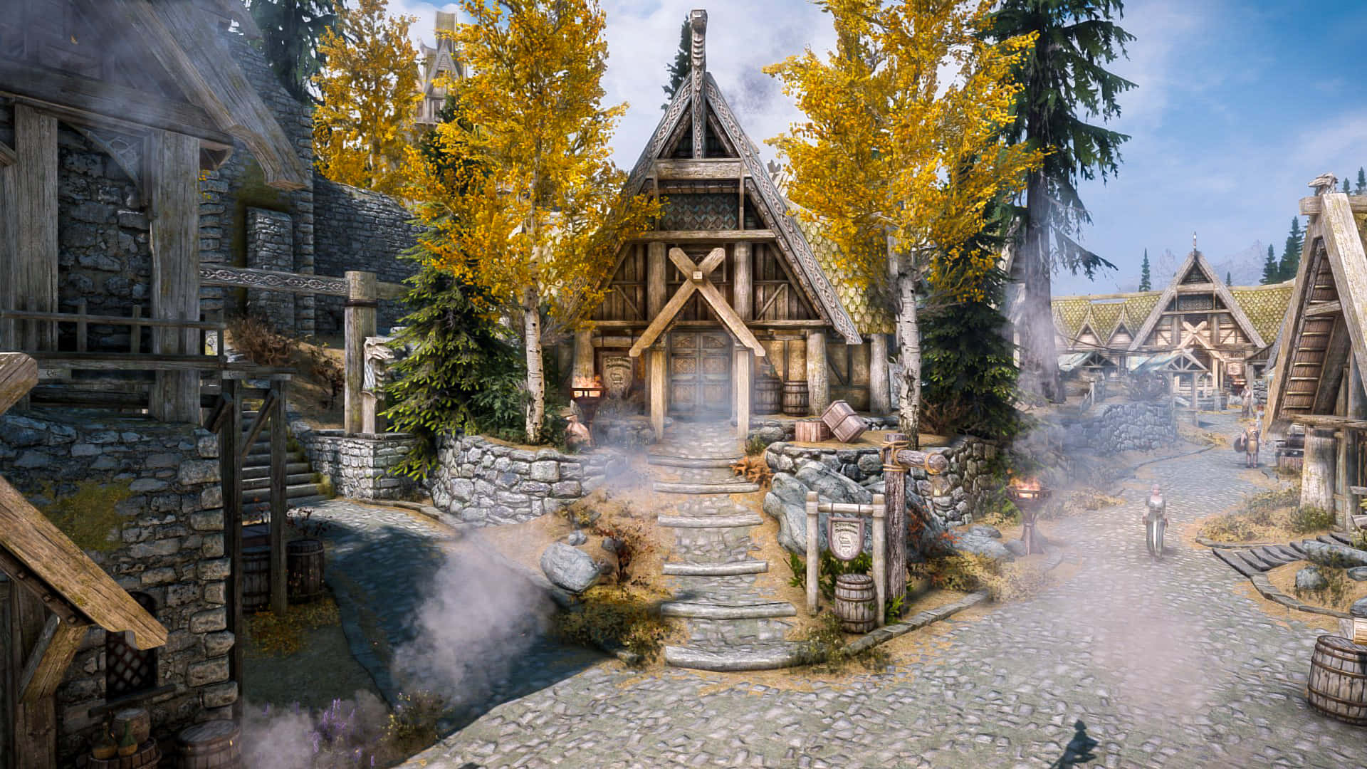 Skyrim Whiterun 桌布 壁紙 — 一個質樸的中世紀村莊，有木屋、石徑和秋樹，在明亮的藍天下。