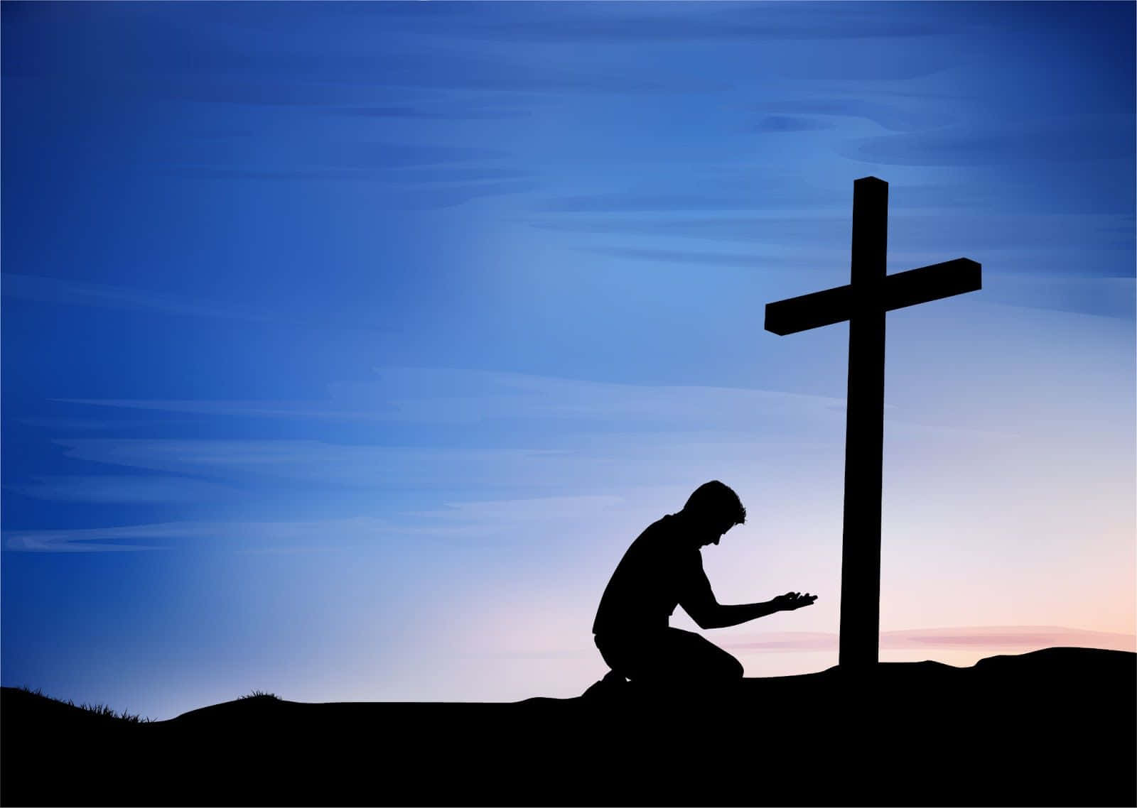 Praying 桌布 壁紙 — 一個跪著祈禱的人的剪影，旁邊有一個大十字架，背景是帶有漸變藍色和粉紅色色調的暮色天空。