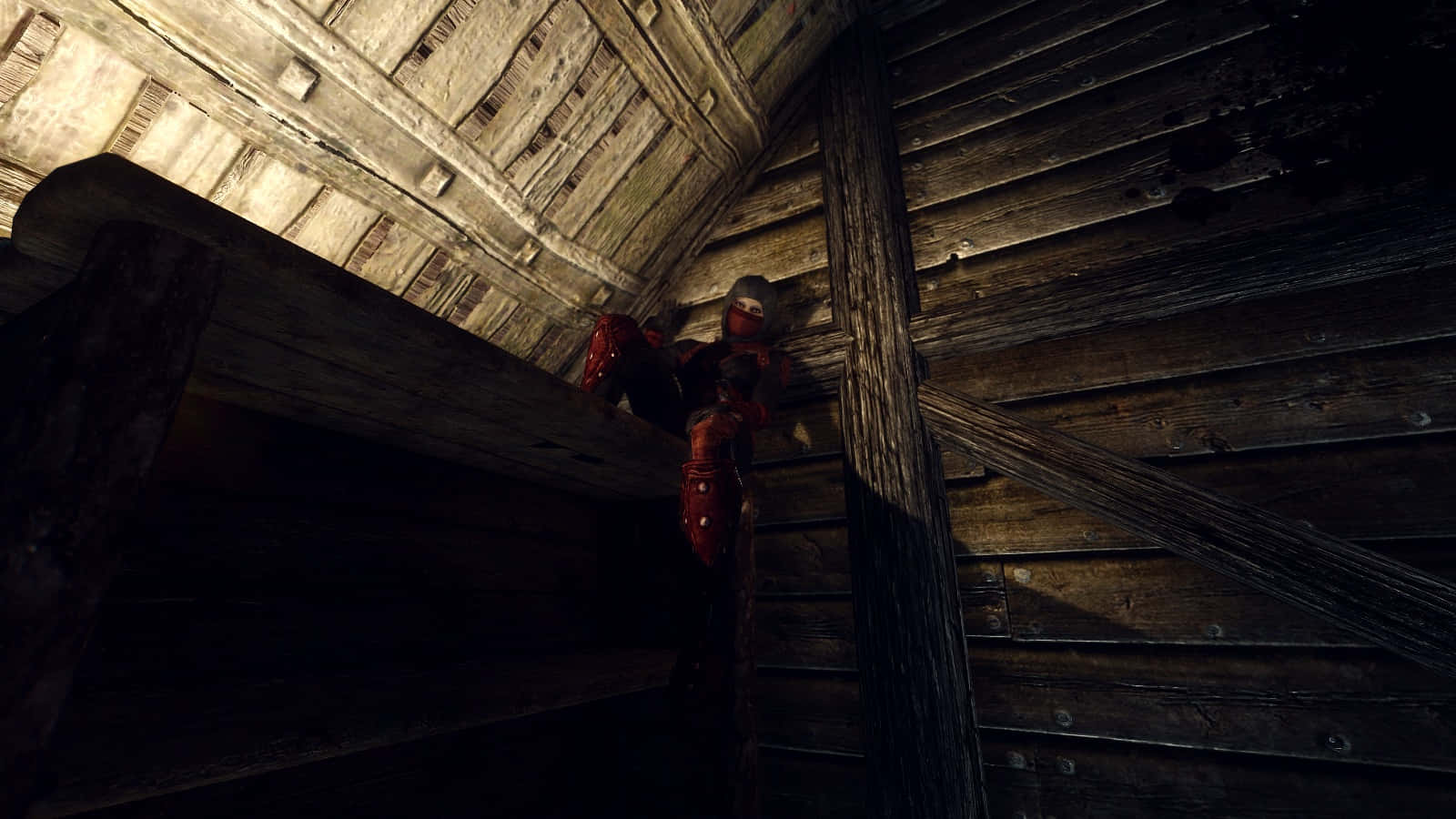 Skyrim Astrid 桌布 壁紙 — 一個身穿紅色盔甲的人物蹲在昏暗的木製閣樓中，破舊的木板和橫樑投下深深的陰影。