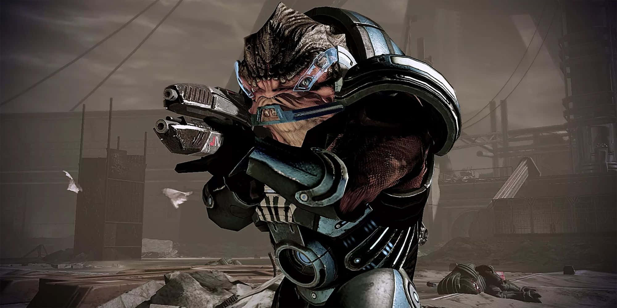 Mass Effect Grunt 桌布 壁紙 — 一個身穿重甲、眼睛發光的外星戰士在骯髒的工業廢土中瞄準雙槍。