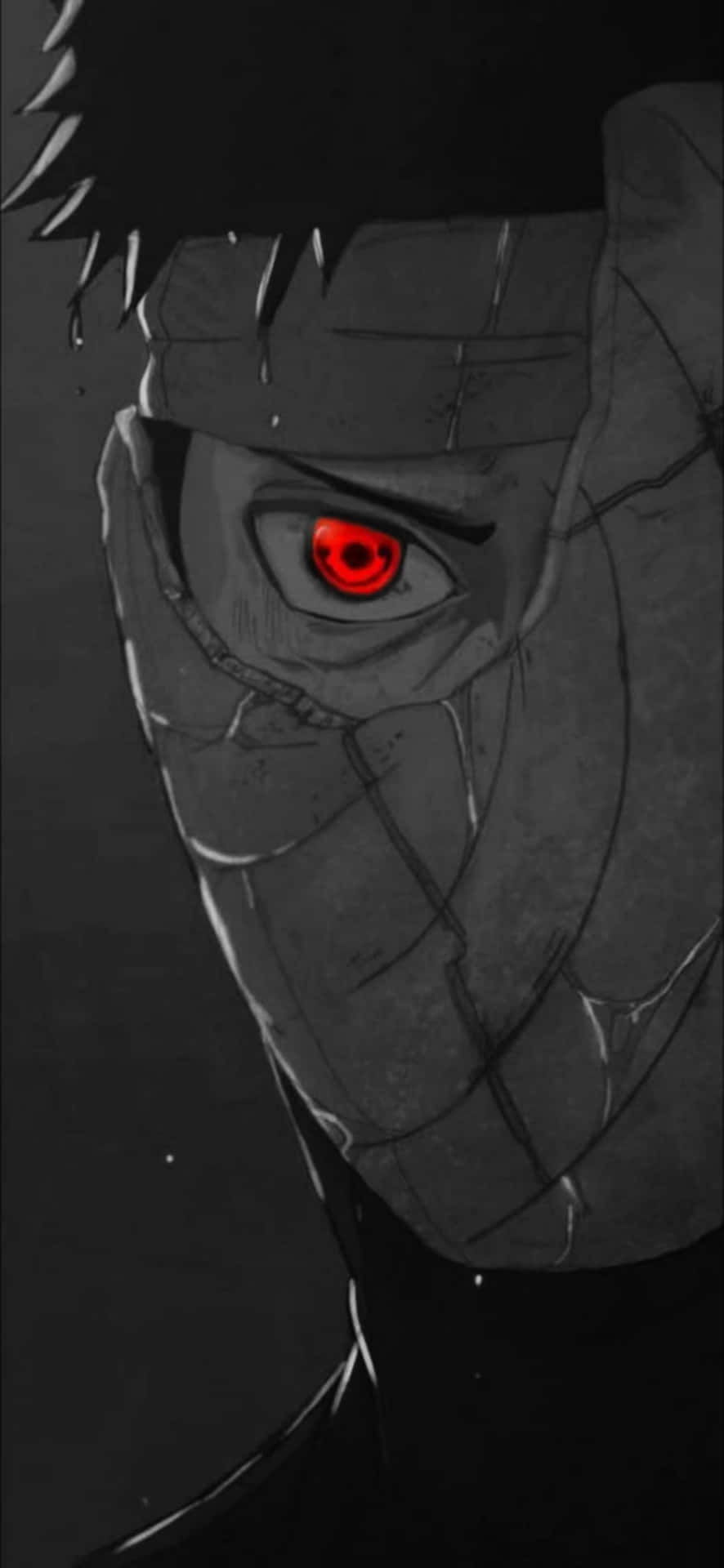 Akatsuki Tobi 桌布 壁紙 — 一個近距離的動漫角色，戴著破裂的面具，在黑暗背景中有一隻發光的紅色眼睛。