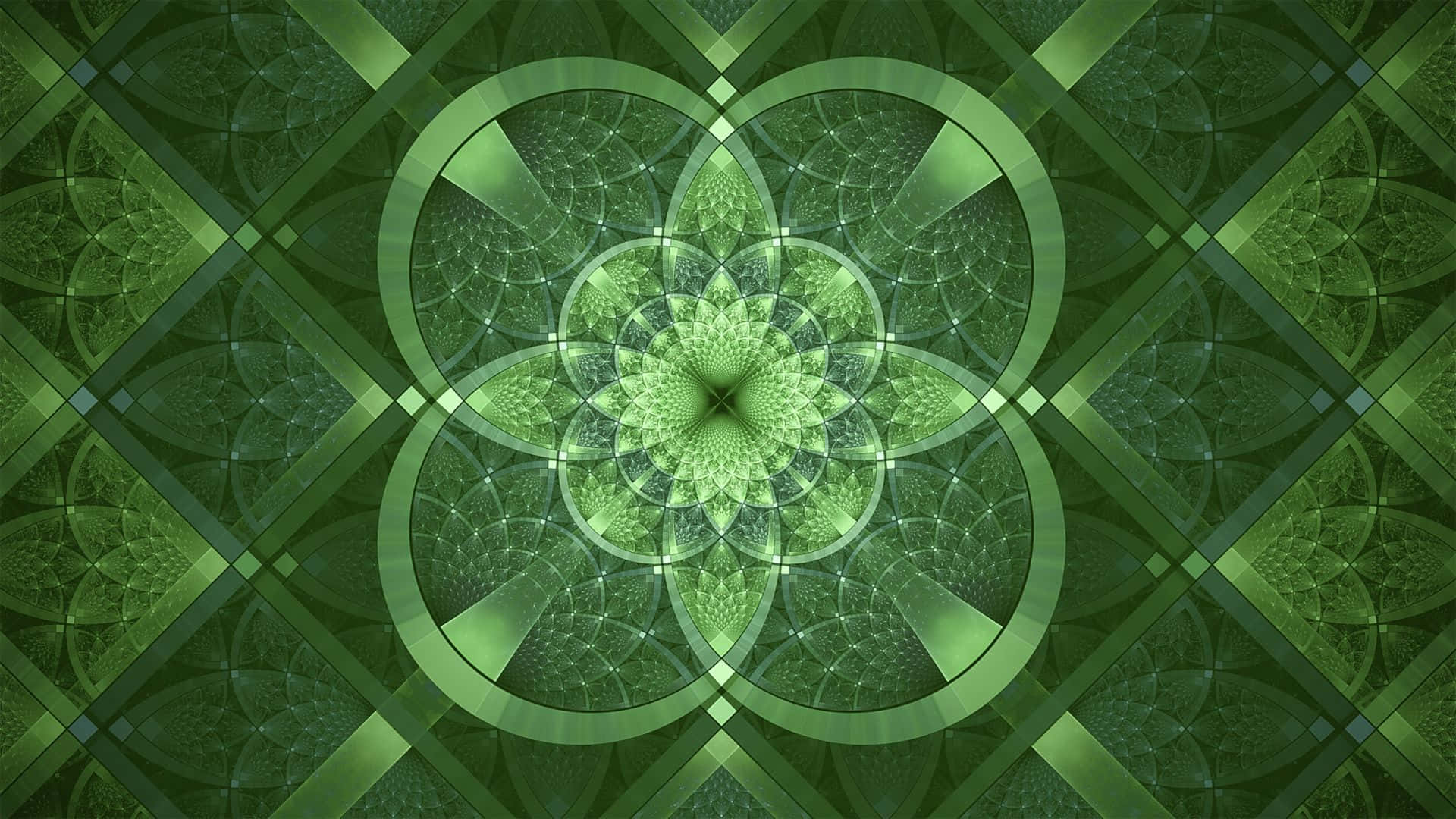 碎形動畫 桌布 壁紙 — 一個迷人的綠色分形曼陀羅，具有從中央花狀核心輻射出的對稱幾何圖案。