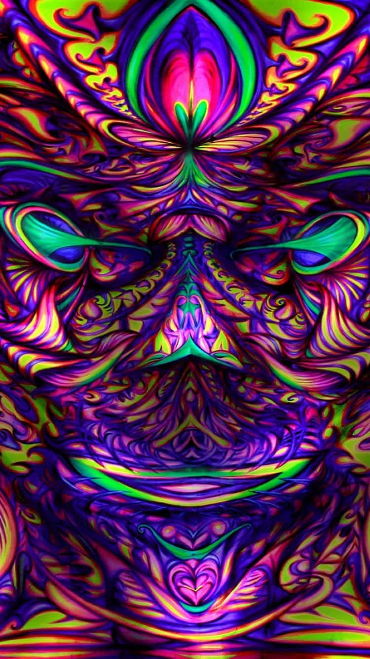 Psychedelic Grunge 桌布 壁紙 — 一個迷幻萬花筒般的面孔，帶有旋轉的霓虹色彩和從中央發光核心輻射出的對稱圖案。