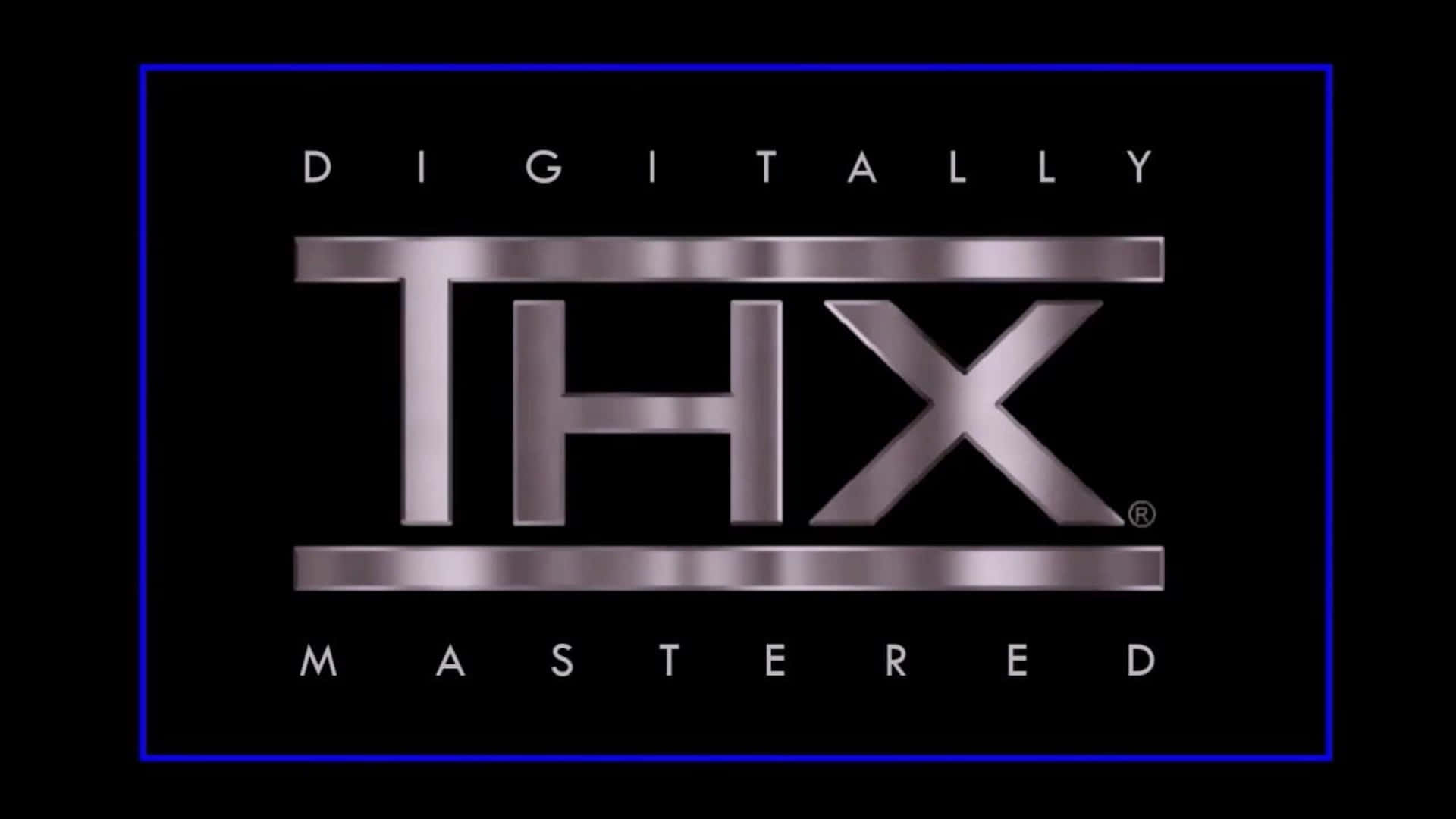 Thx 桌布 壁紙 — 一個金屬質感的THX標誌，帶有「Digitally Mastered」文字，並以發光的藍色邊框框住，背景為黑色。