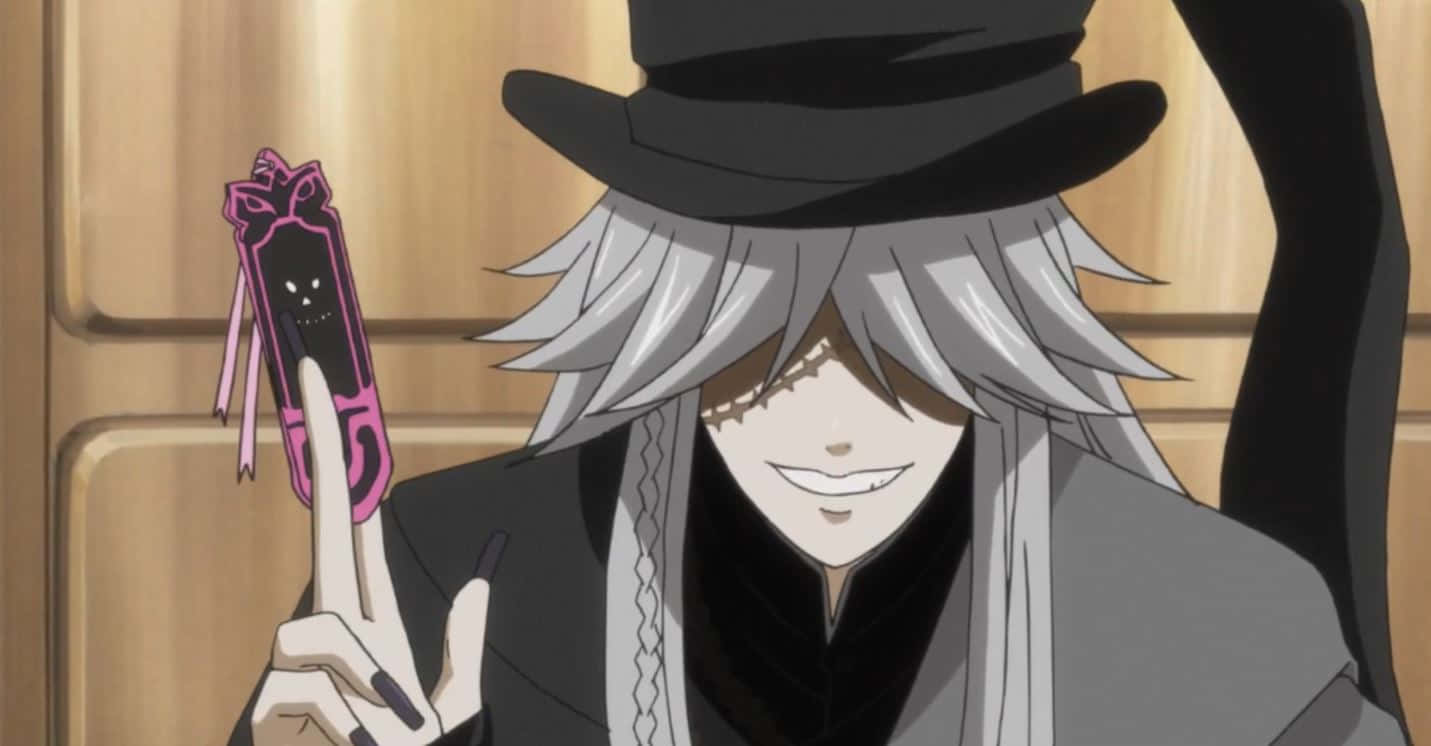 Black Butler Undertaker 桌布 壁紙 — 一個銀髮動漫角色戴著黑色高頂帽，拿著一個帶有咧嘴笑臉的粉紅色被詛咒的電話。