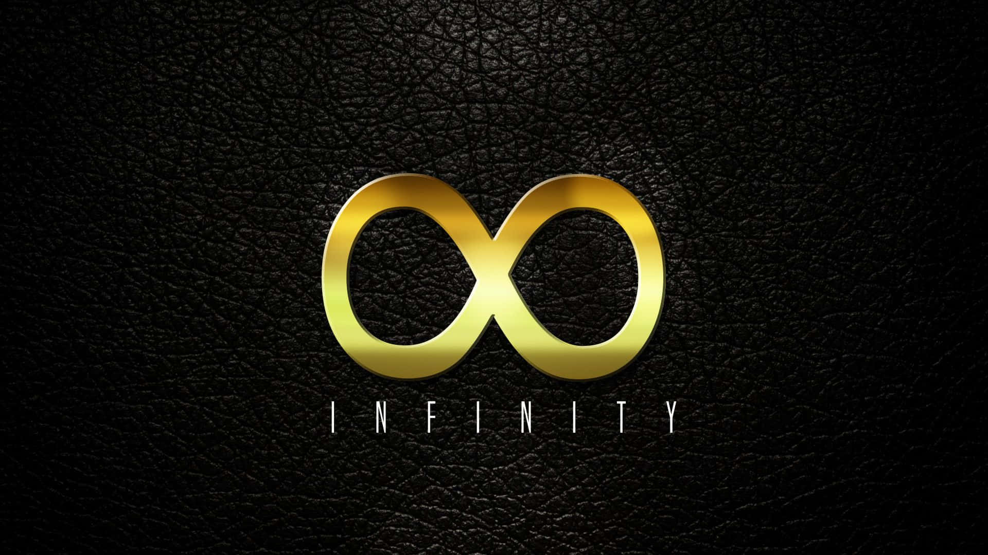infinity 桌布 壁紙 — 一個閃亮的金色無限符號放置在帶有紋理的黑色皮革上，下方有白色的「無限」字樣。