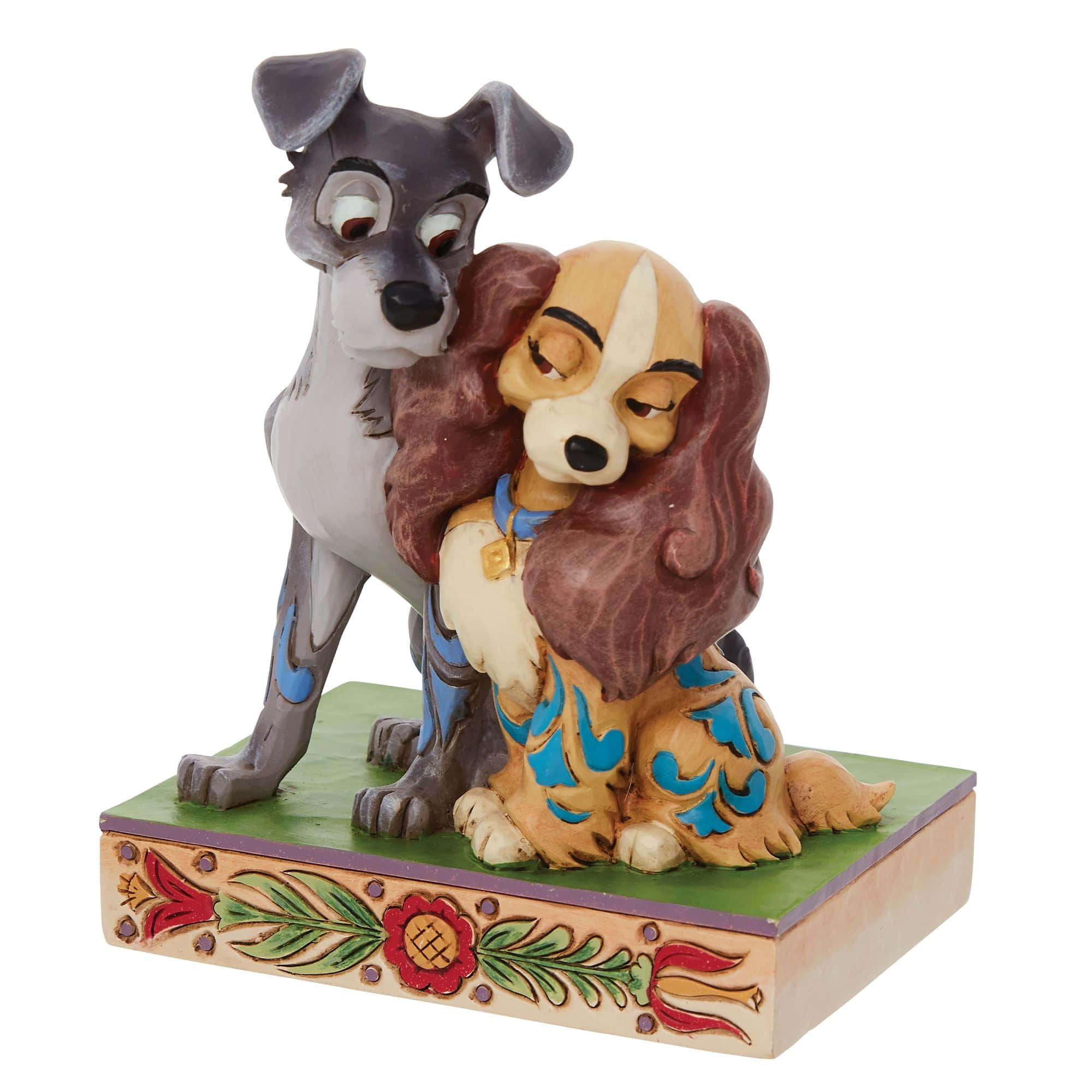 lady and the tramp 桌布 壁紙 — 一個陶瓷公仔，兩隻動畫狗在裝飾有花卉圖案的底座上擁抱。