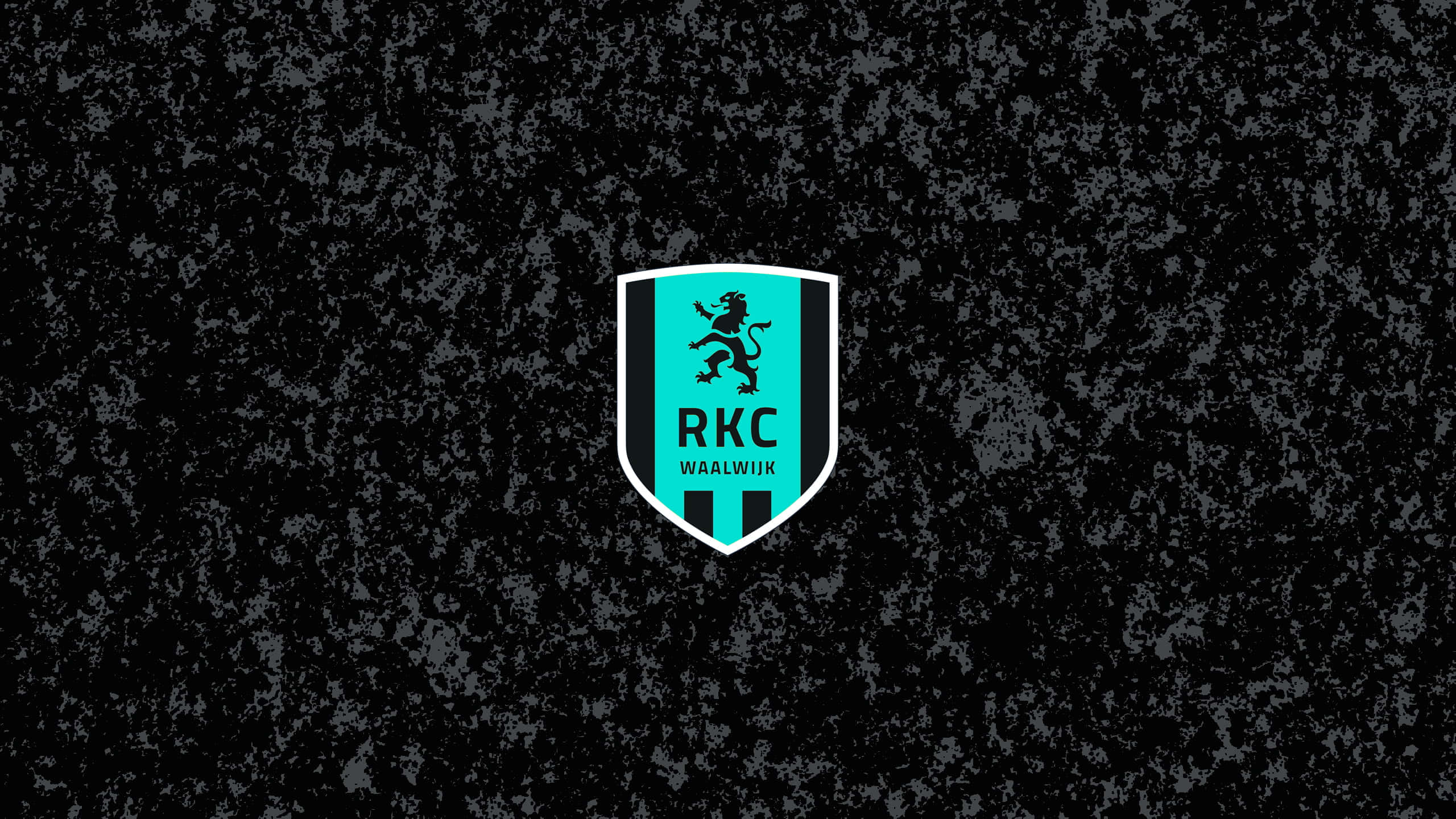 Rkc Waalwijk 桌布 壁紙 — 一個青綠色和黑色的盾牌標誌，上面有一隻躍立的獅子和文字，居中放置在粗糙的深色背景上。