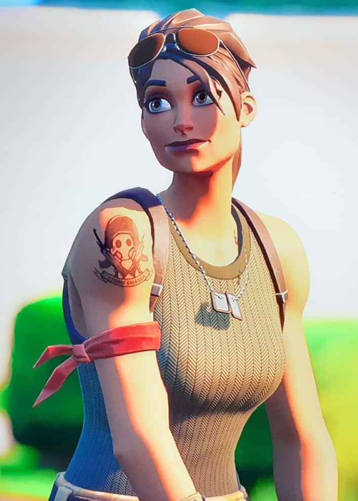Ramirez Fortnite 桌布 壁紙 — 一個風格化的女性角色，帶有骷髏紋身和飛行員護目鏡，在明亮的戶外背景下自信地看著觀眾。