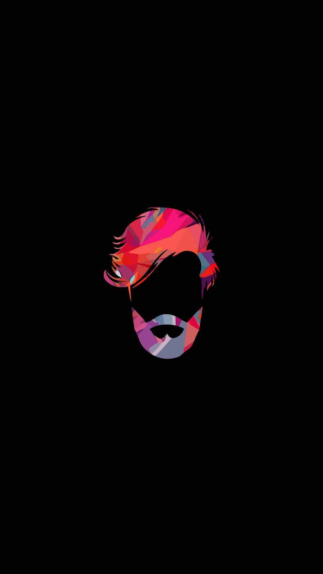 beard 桌布 壁紙 — 一個風格化的幾何肖像，描繪一個男人的頭部，帶有鮮豔的粉紅色、紫色和藍色切面，背景為黑色。