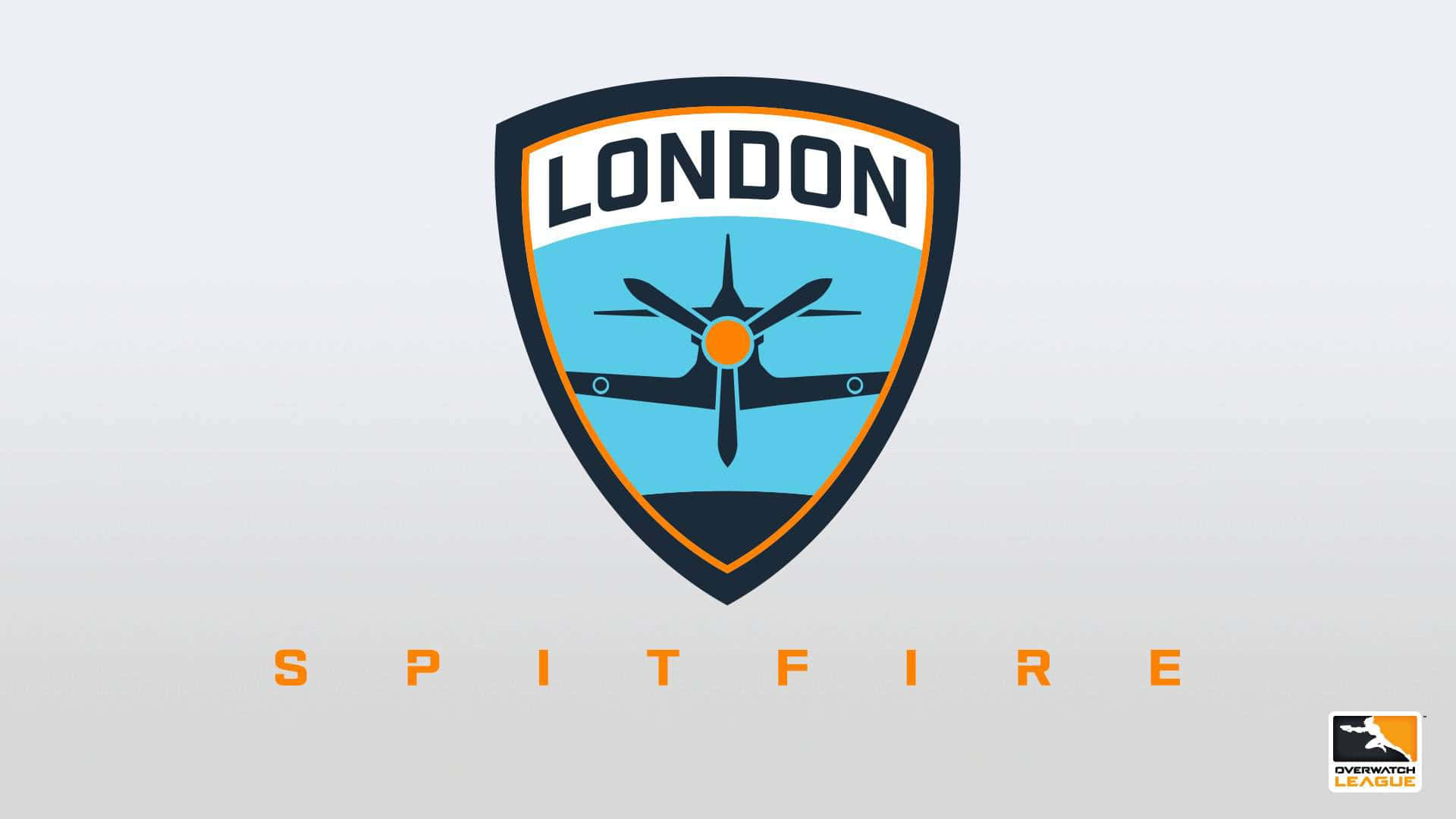 Overwatch League 桌布 壁紙 — 一個風格化的盾牌標誌，上面有一架噴火戰鬥機，上方有「LONDON」，下方有「SPITFIRE」，背景為淺灰色。