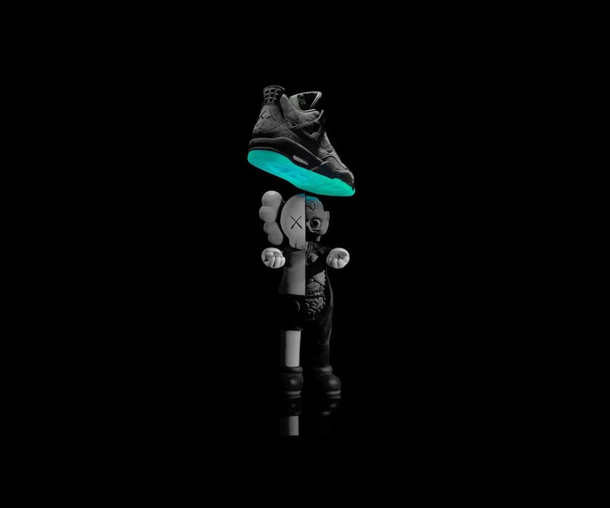 Kaws X Air Jordan 桌布 壁紙 — 一個風格化的黑白人偶在純黑色背景上，頭頂平衡著一雙發光的青綠色運動鞋。