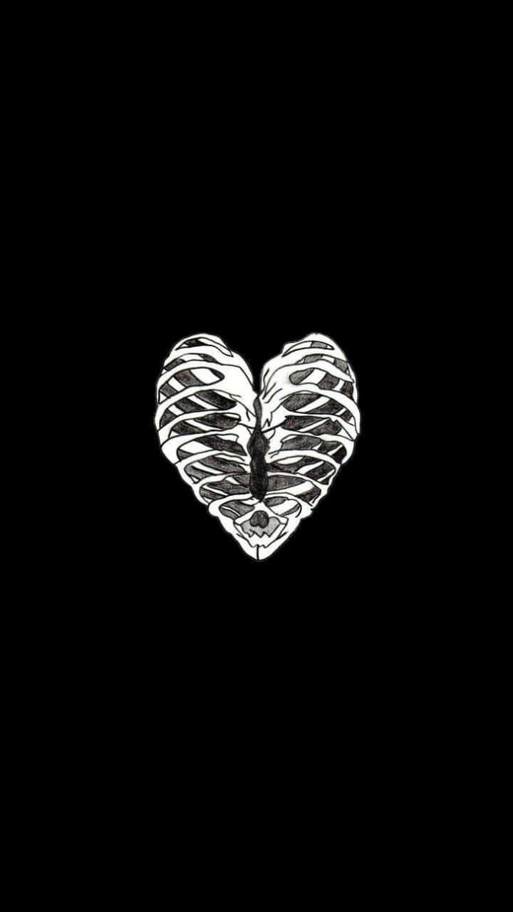Aesthetic Black Heart 桌布 壁紙 — 一個鮮明的白色骷髏心臟插圖，居中於純黑色背景上，具有高對比度。