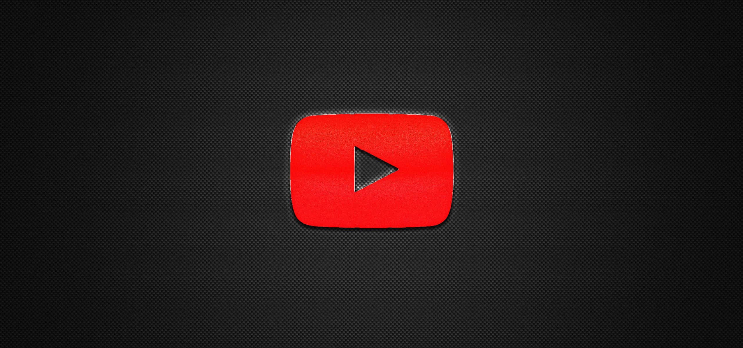 YouTube Logo 桌布 壁紙 — 一個鮮豔的紅色 YouTube 播放按鈕圖示，居中在深色紋理背景上。