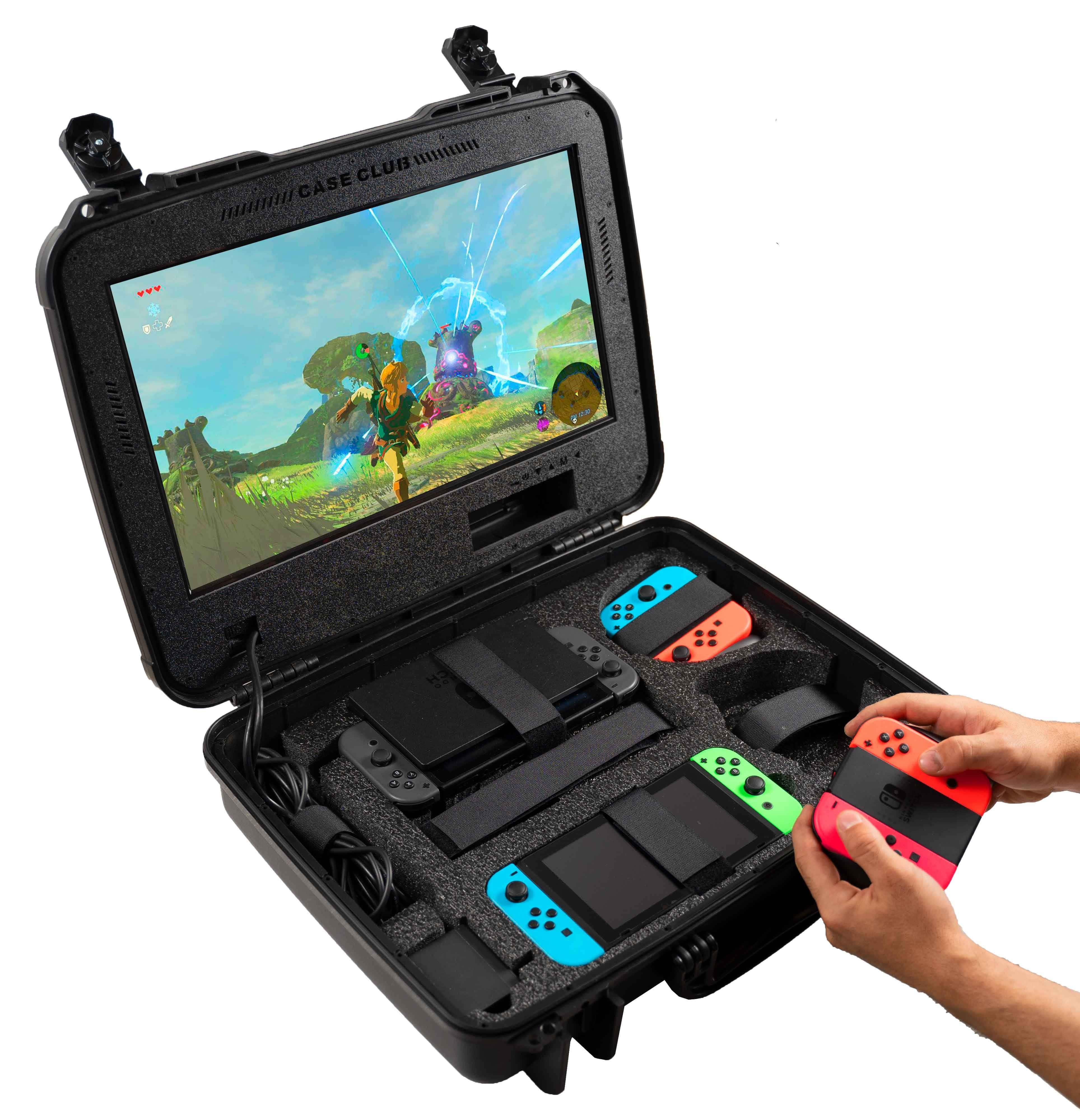 Gaming Accessories 桌布 壁紙 — 一個黑色堅固保護殼內有Nintendo Switch，配備彩色控制器及顯示薩爾達遊戲畫面的螢幕。