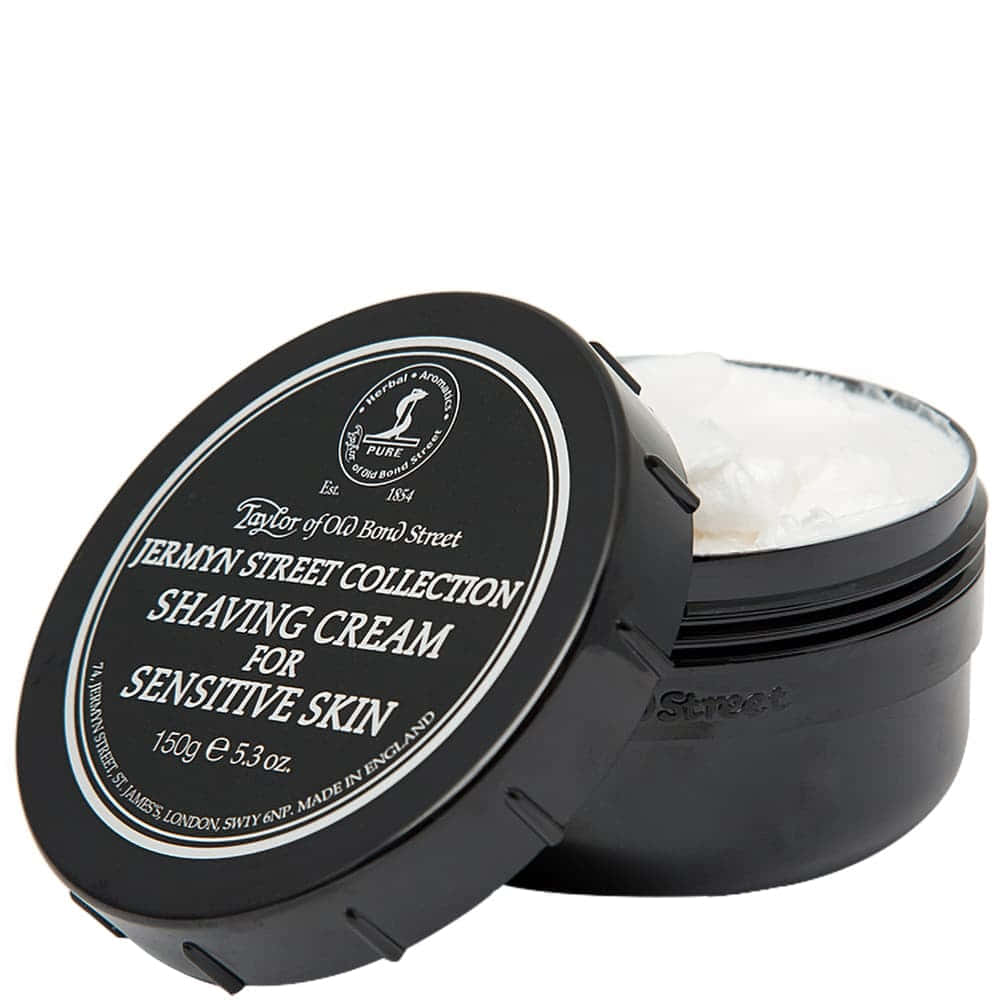 Shaving Cream 桌布 壁紙 — 一個黑色罐裝的Taylor of Old Bond Street敏感肌膚剃鬚膏，蓋子微微打開，露出乳白色內容物。