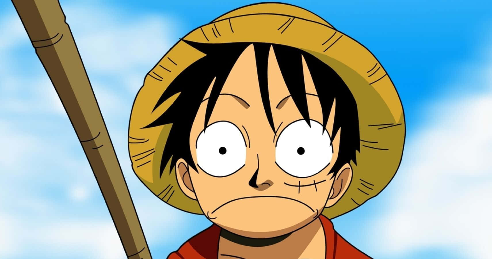 路飛 桌布 壁紙 — 一個黑髮戴草帽的動漫男孩，眼神堅定地凝視著明亮的藍天。