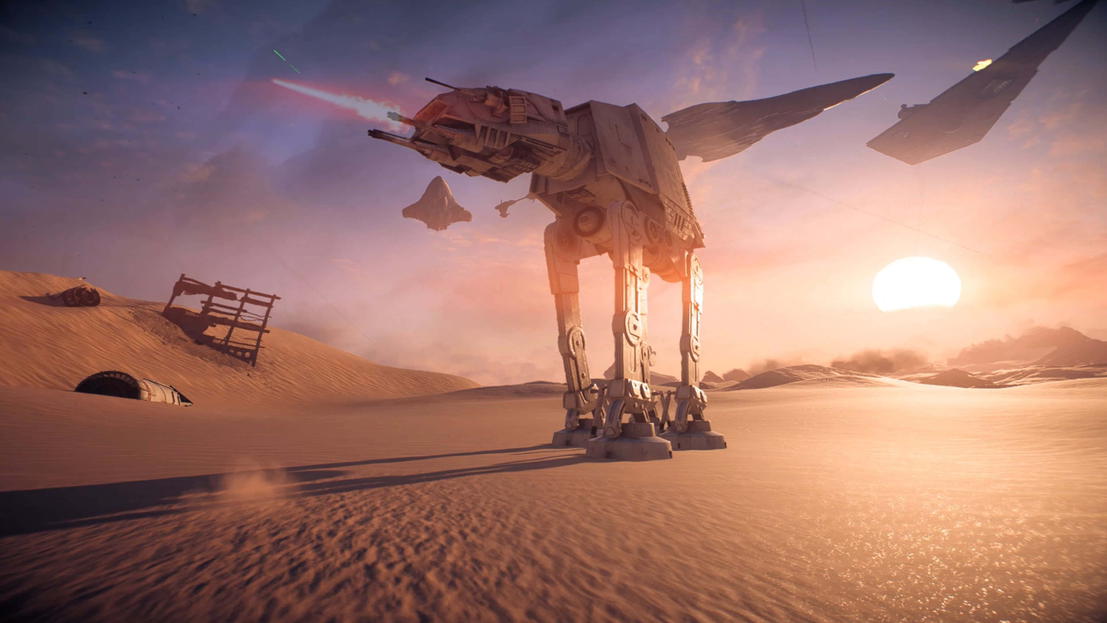 The Battle Of Jakku 桌布 壁紙 — 一台巨大的AT-AT步行機穿越沙漠景觀，同時發射激光，星際戰鬥機在 vibrant 的日落期間飛越頭頂。
