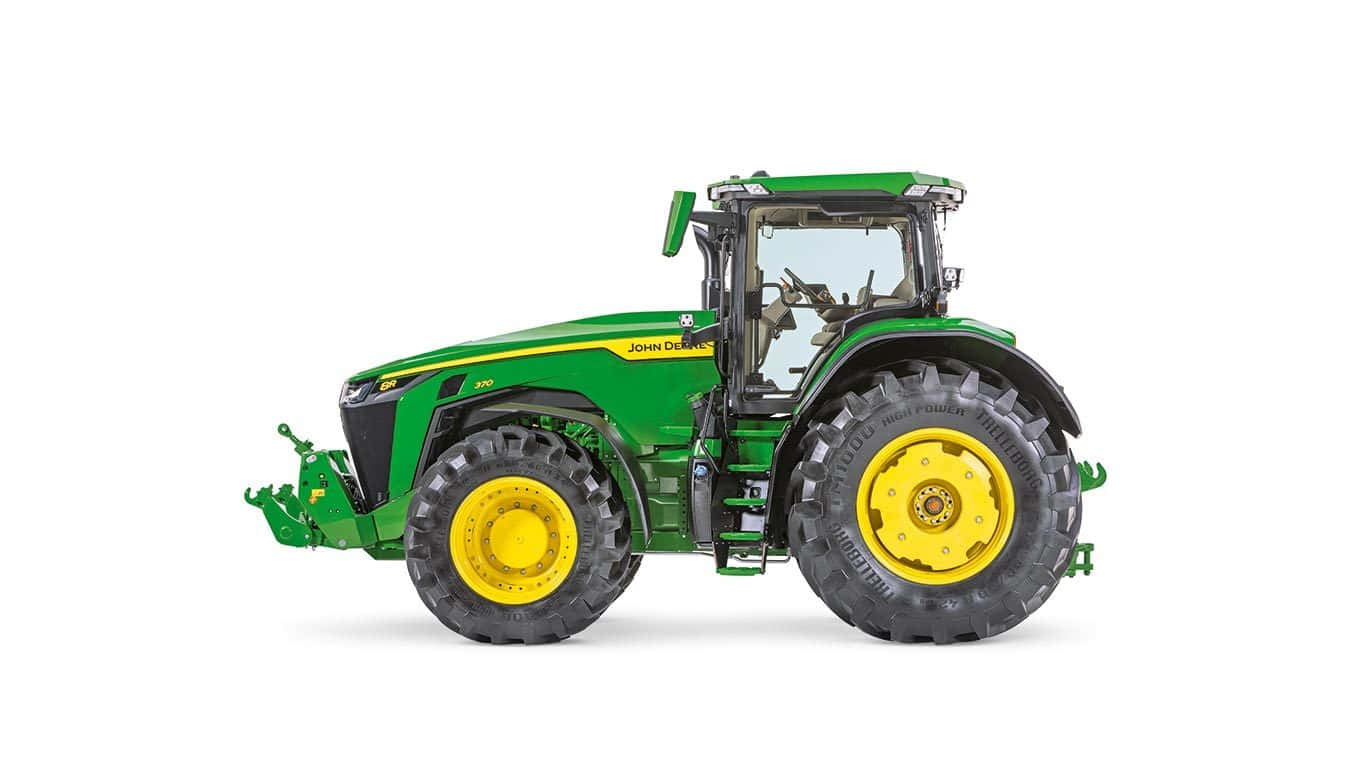 John Deere 桌布 壁紙 — 一台時尚的綠色和黃色約翰迪爾拖拉機，配有大黑色輪胎，孤立在乾淨的白色背景上。